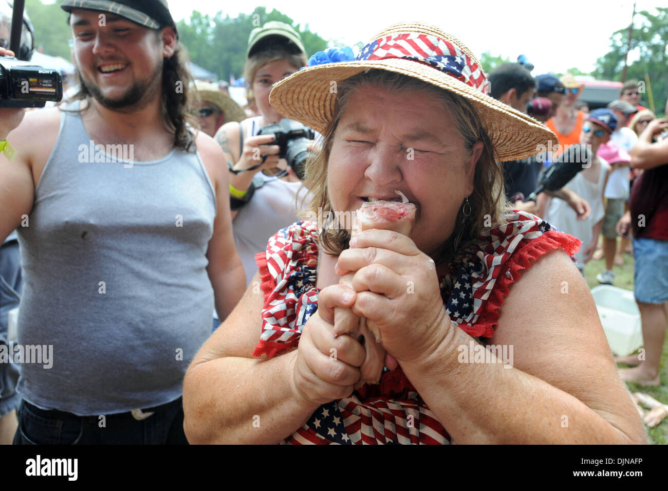 Mar 11, 2008 - East Dublin, Georgia, USA - 'Redneck Grandma' Barbara Bailey samples the cuisine in the Bobbing for Pigs Feet event during during the 13th annual Summer Redneck Games at Buckeye Park in East Dublin, Georgia, on Saturday. The annual homage to Southerners, began as a spoof to the 1996 Summer Olympics in Atlanta. Thousands of revelers attend the event whose events inclu Stock Photo