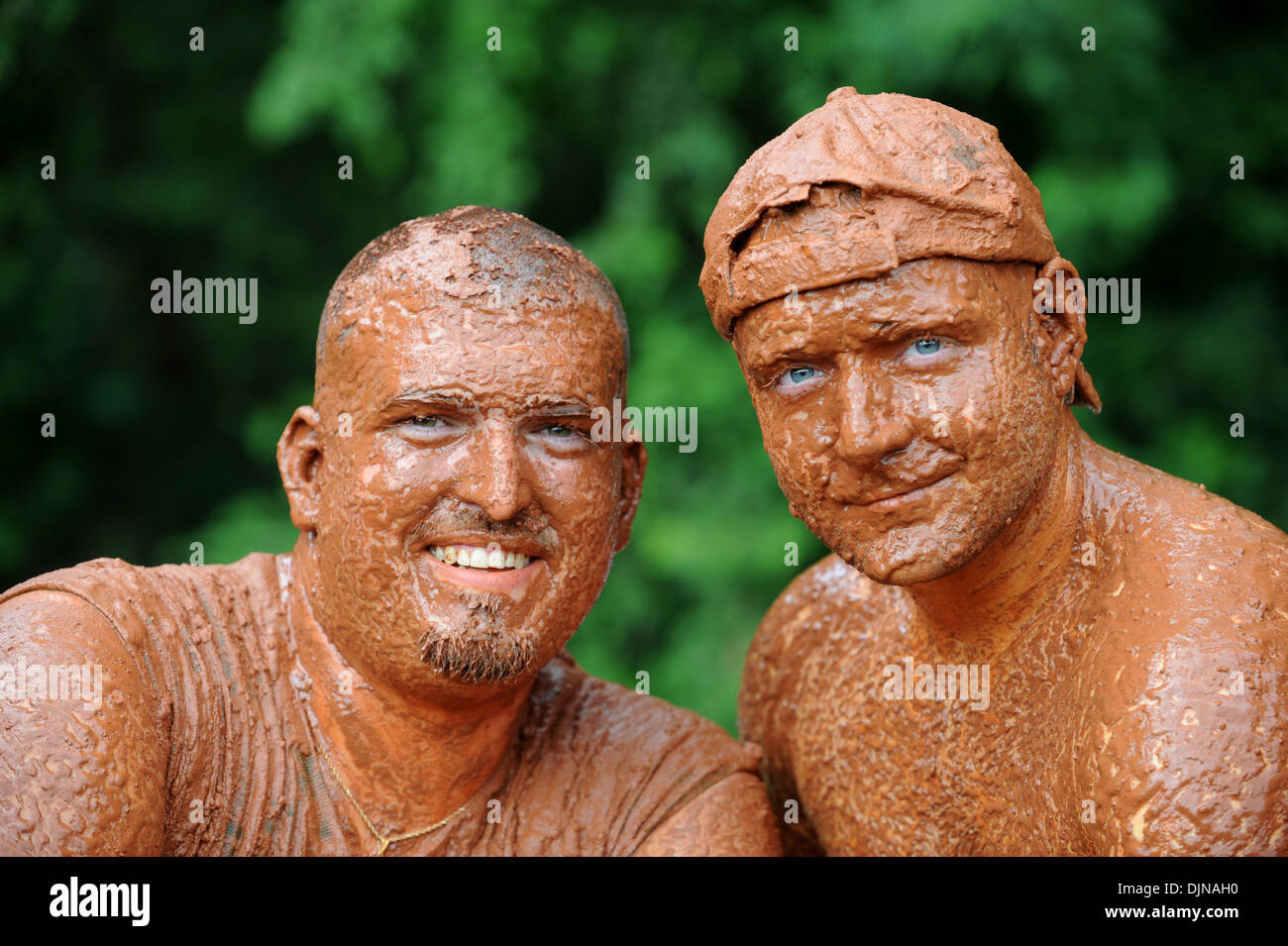 Mar 11, 2008 - East Dublin, Georgia, USA - Bubba Womack, left, and Jerry Minix after getting dirty in the mudpit while attending the 13th annual Summer Redneck Games at Buckeye Park in East Dublin, Georgia, on Saturday. The annual homage to Southerners, began as a spoof to the 1996 Summer Olympics in Atlanta. Thousands of revelers attend the event whose events include bobbing for p Stock Photo