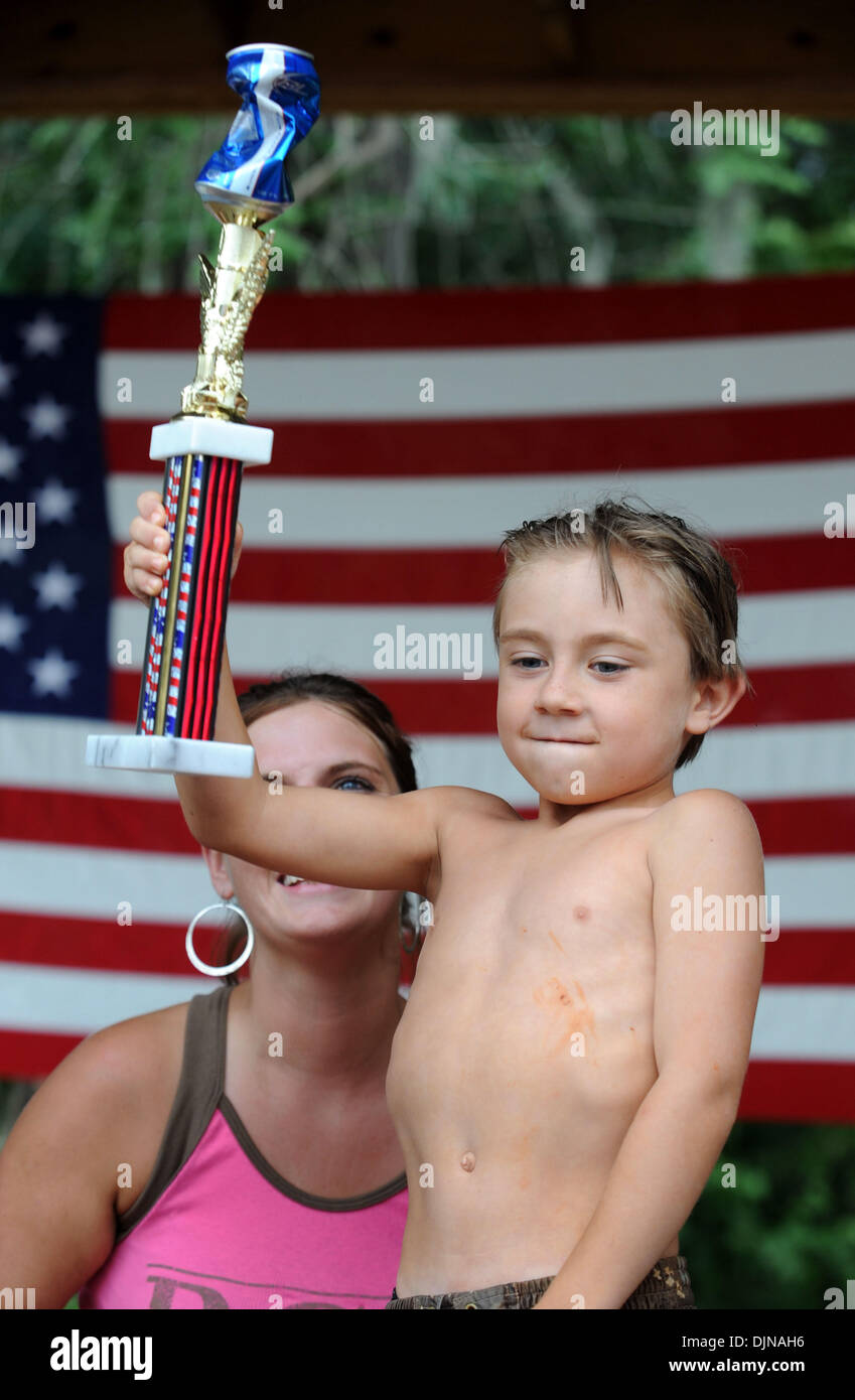 Mar 11, 2008 - East Dublin, Georgia, USA - Armpit serenade winner Aubrey Matthews, 7, celebrates his victory during the 13th annual Summer Redneck Games at Buckeye Park in East Dublin, Georgia, on Saturday. The annual homage to Southerners, began as a spoof to the 1996 Summer Olympics in Atlanta. Thousands of revelers attend the event whose events include bobbing for pigs feet, the Stock Photo