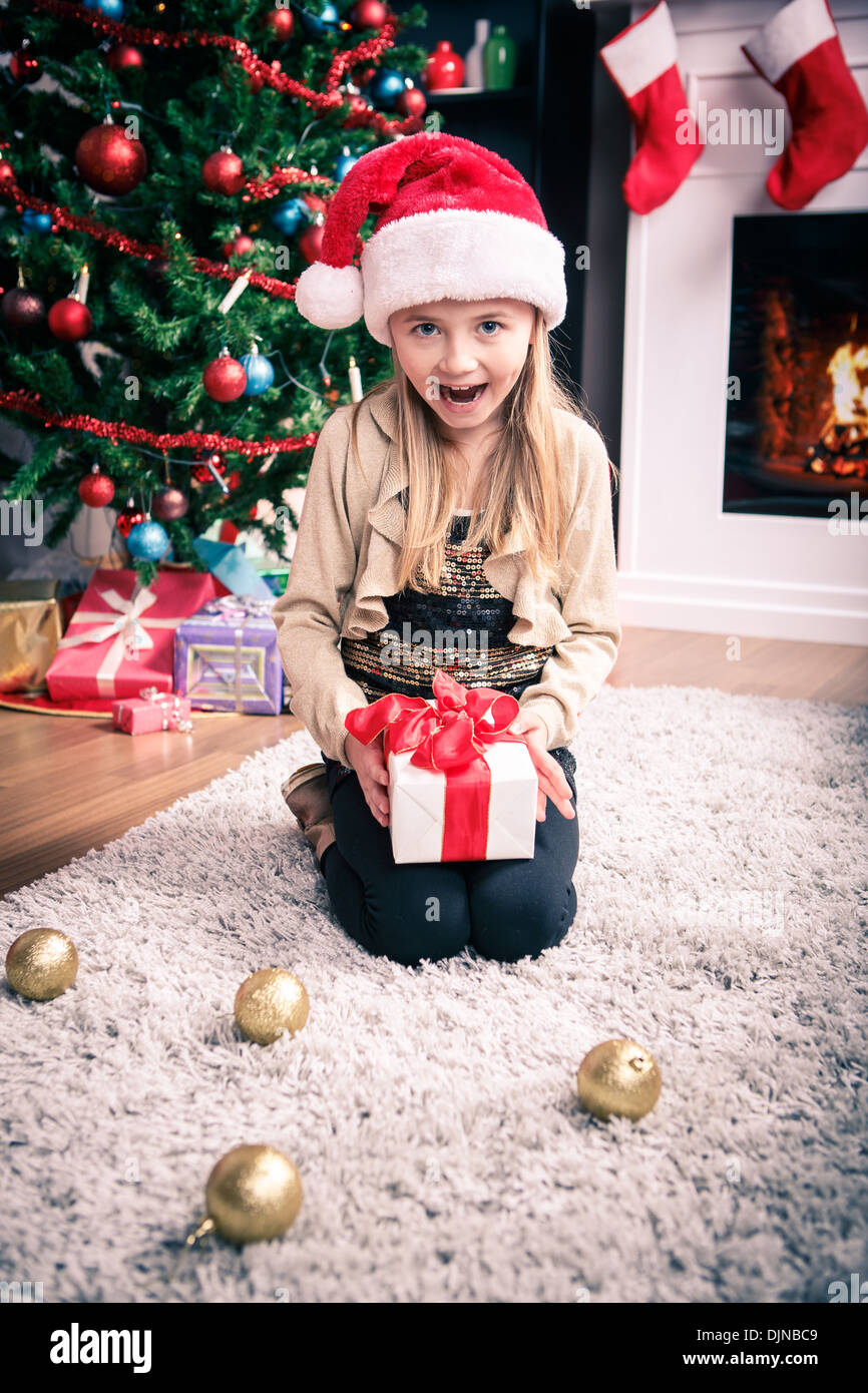 a little girl getting a Christmas gift Stock Photo