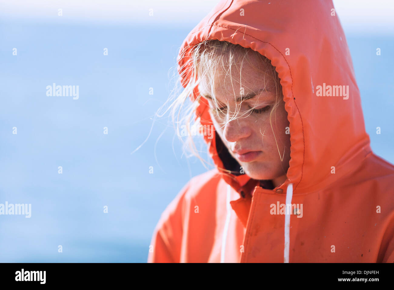Portrait Of Emma Laukitis As She Concentrates On Baiting Commercial Halibut Longline Hooks With Pink Salmon, Alaska Peninsula Stock Photo