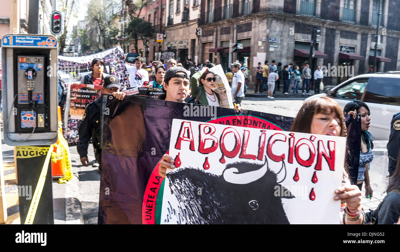 Mexico City, Centro Historico District, Mexico; November 28, 2013. Young woman carrying sign urging the abolition of bullfighting is among animal rights activists chanting Toros SI! Toreros NO! marching in Mexico City on Thursday. Credit:  Dorothy Alexander/Alamy Live News Stock Photo