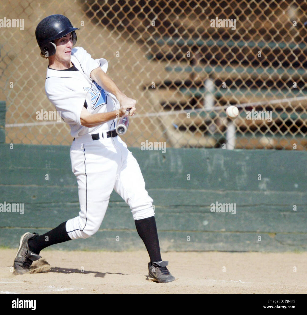 Tennyson's (33) Brian Prentiss hits a single up the middle that scores