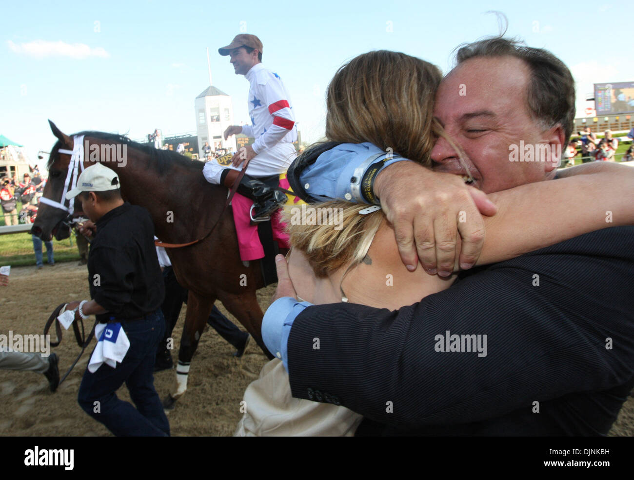 Big Brown trainer Rick Dutrow  hugs exercise rider Michelle Nevin as the Derby winner and Kent Desormeaux pass in the background before the winner's circle for the 134th running of the Kentucky Derby Saturday May 3, 2008, at Churchill Downs, Louisville, Ky. Photo by David Stephenson  (Credit Image: © Lexington Herald Leader/ZUMA Press) Stock Photo