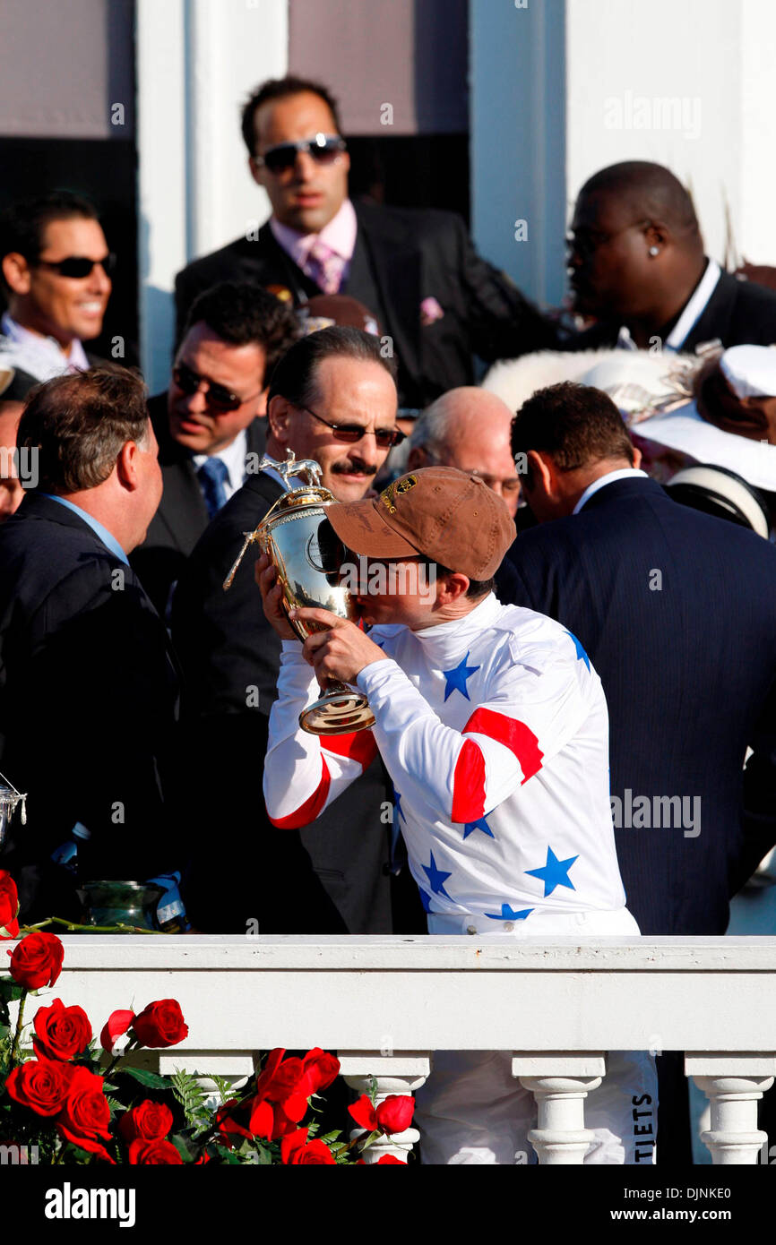 Jockey Kent Desormeaux kisses the Kentucky Derby Trophy in the Winners