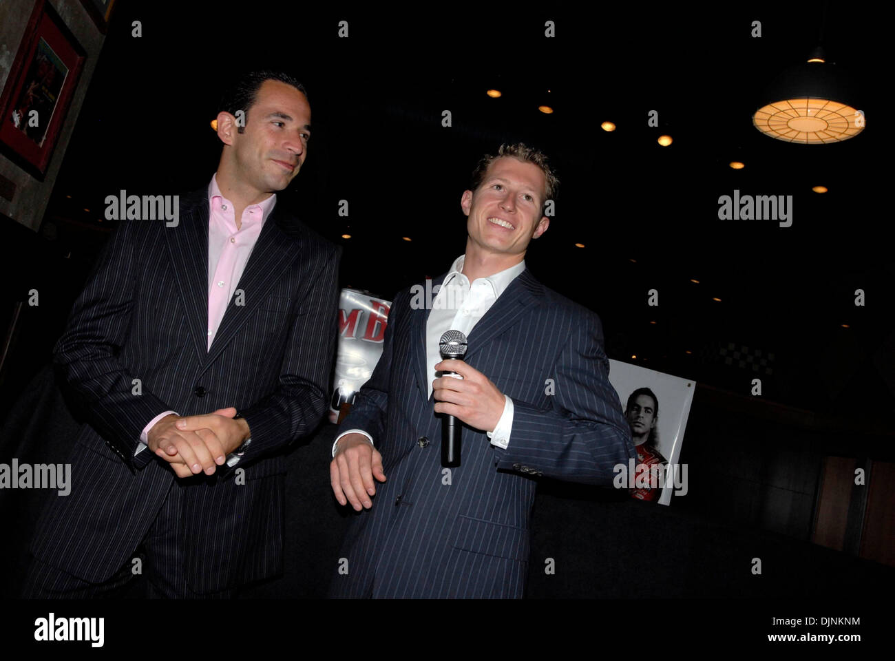 May 24, 2008 - Indianapolis, Indiana, USA - Indy 500 race car drivers RYAN BRISCOE and HELIO CASTRONEVES talk to a group of Jim Beam employees the night before the 2008 Indianapolis 500. Jim Beam sponsored both Castroneves and Briscoe in the 2008 Indy 500. (Credit Image: © Mark Murrmann/ZUMA Press) Stock Photo