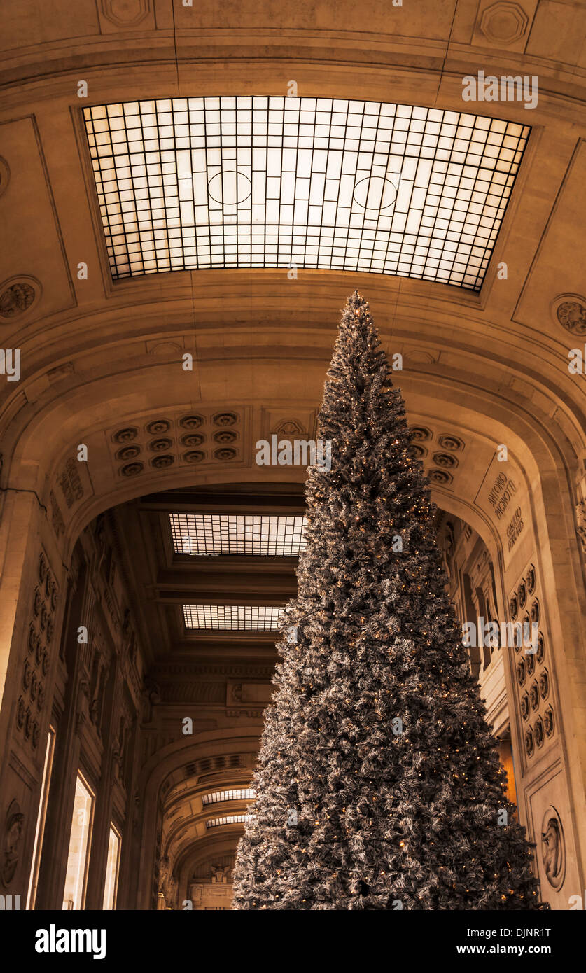 Christmas tree in december at Milan Rail station, Italy Stock Photo