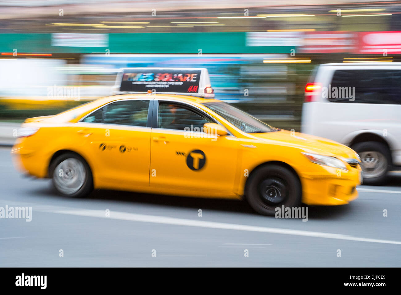 NEW YORK, US - NOVEMBER 21: Motion blurred shot of famous New York yellow taxi. November 21, 2013 in New York. Stock Photo