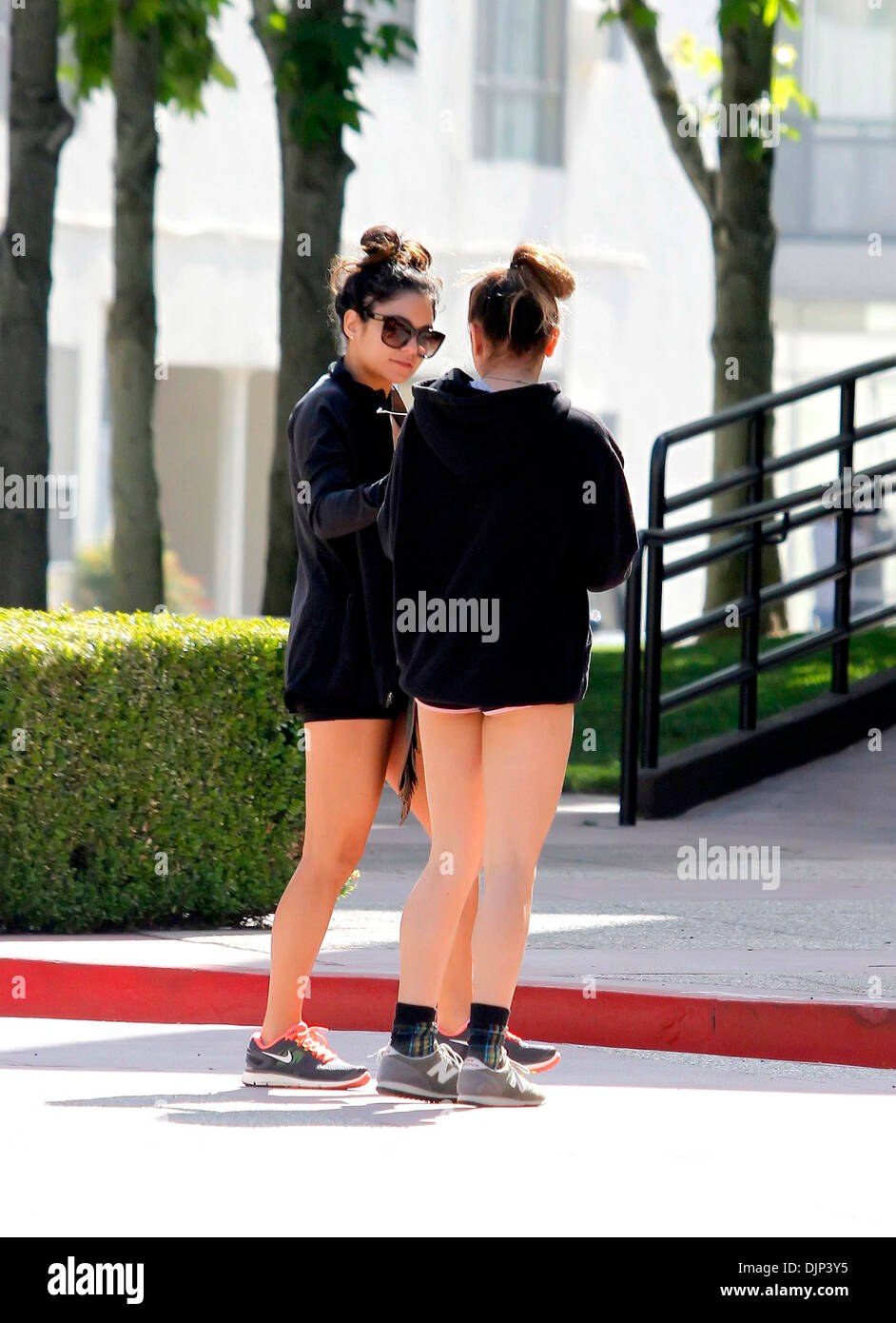 Vanessa Hudgens and Stella Hudgens Vanessa Hudgens dressed casually as she arrives at a gym with her sister Los Angeles Stock Photo
