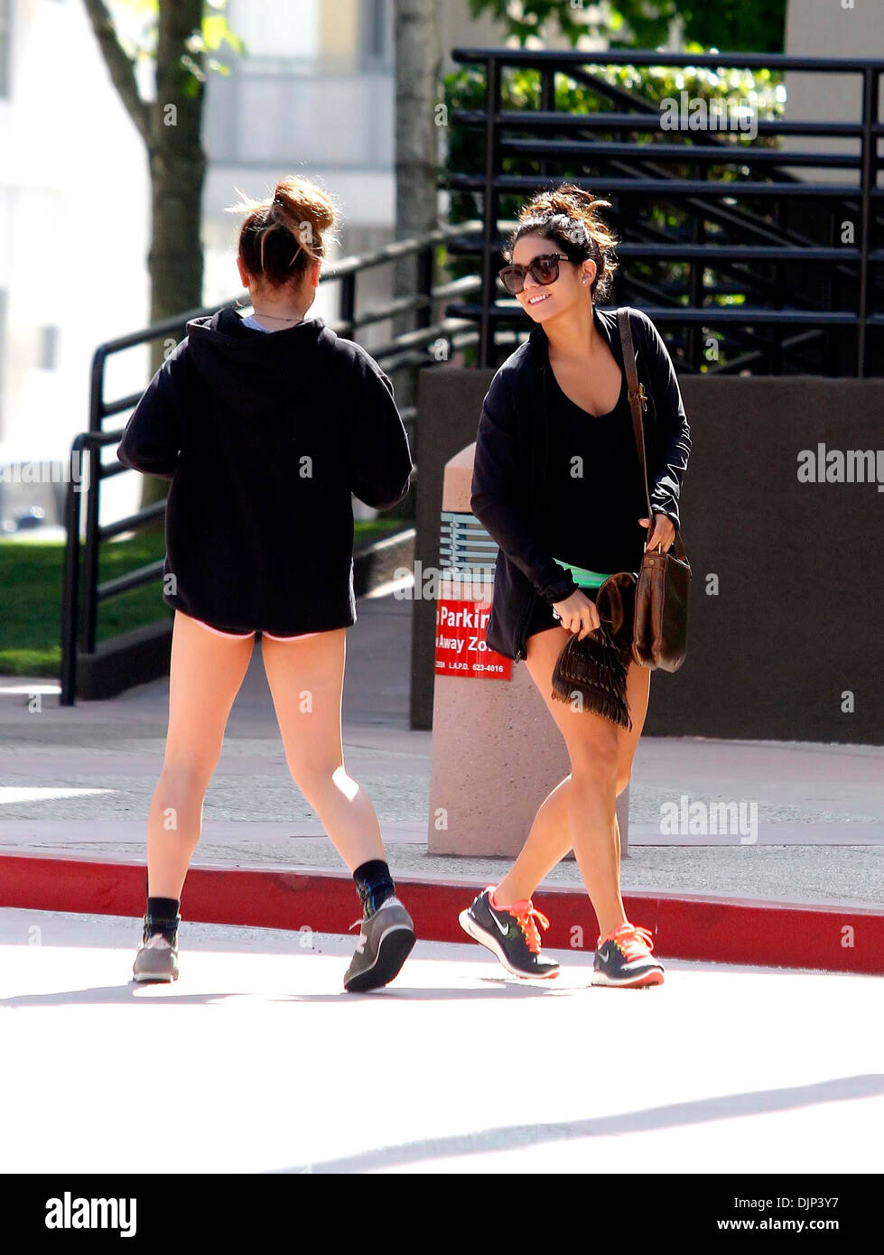Stella Hudgens and Vanessa Hudgens Vanessa Hudgens dressed casually as she arrives at a gym with her sister Los Angeles Stock Photo
