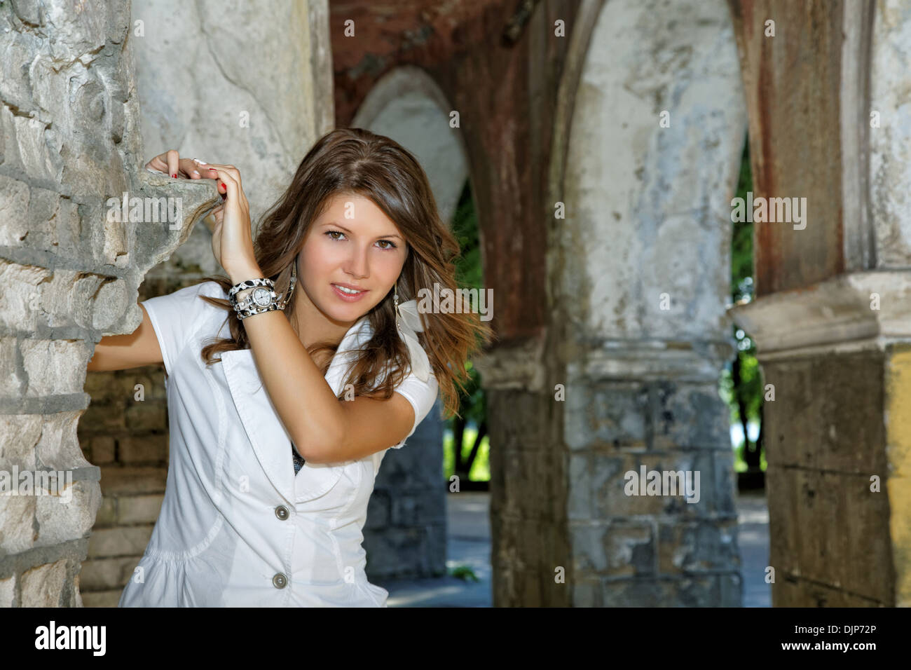 The smiling girl against old walls and arches Stock Photo Alamy