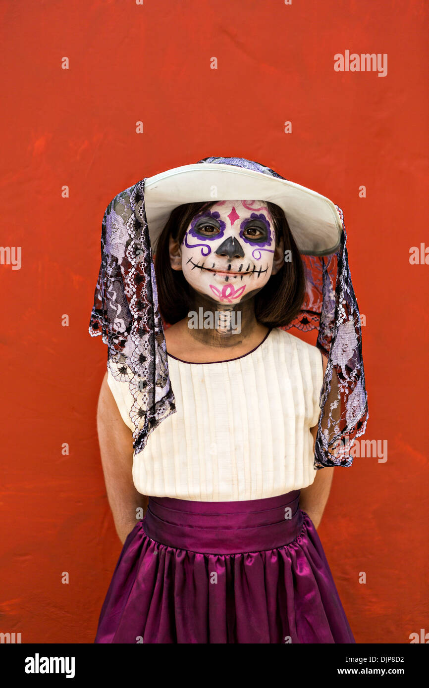 A young girl dressed as La Calavera Catrina celebrating the Day of the Dead festival November 1, 2013 in Oaxaca, Mexico. Stock Photo