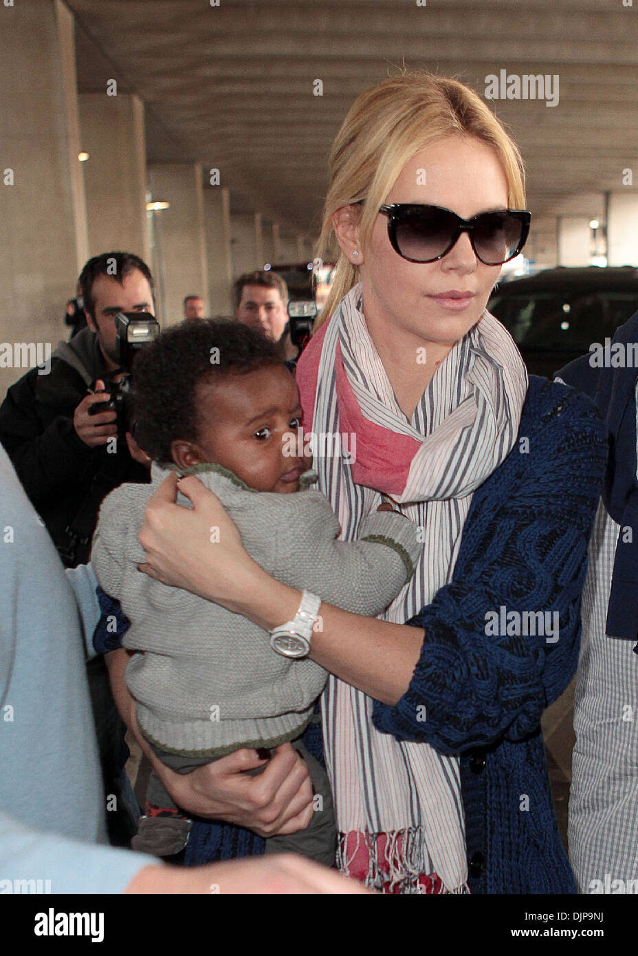 Charlize Theron And Her Son Jackson Arrive At Charles De Gaulle Airport charlize-theron-and-her-son-jackson-arrive-at-charles-de-gaulle-airport