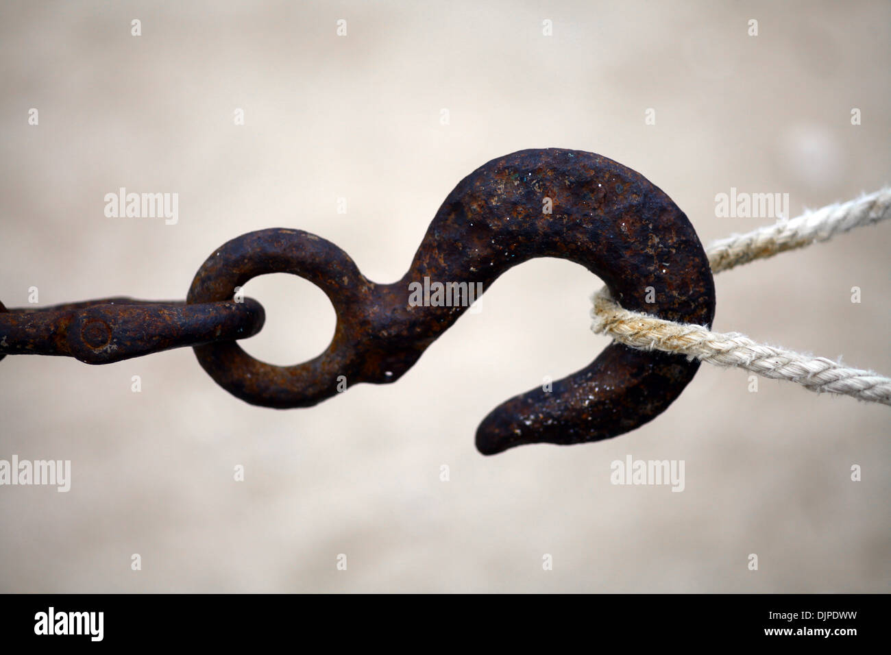Color shot of a rusty hook and a rope Stock Photo