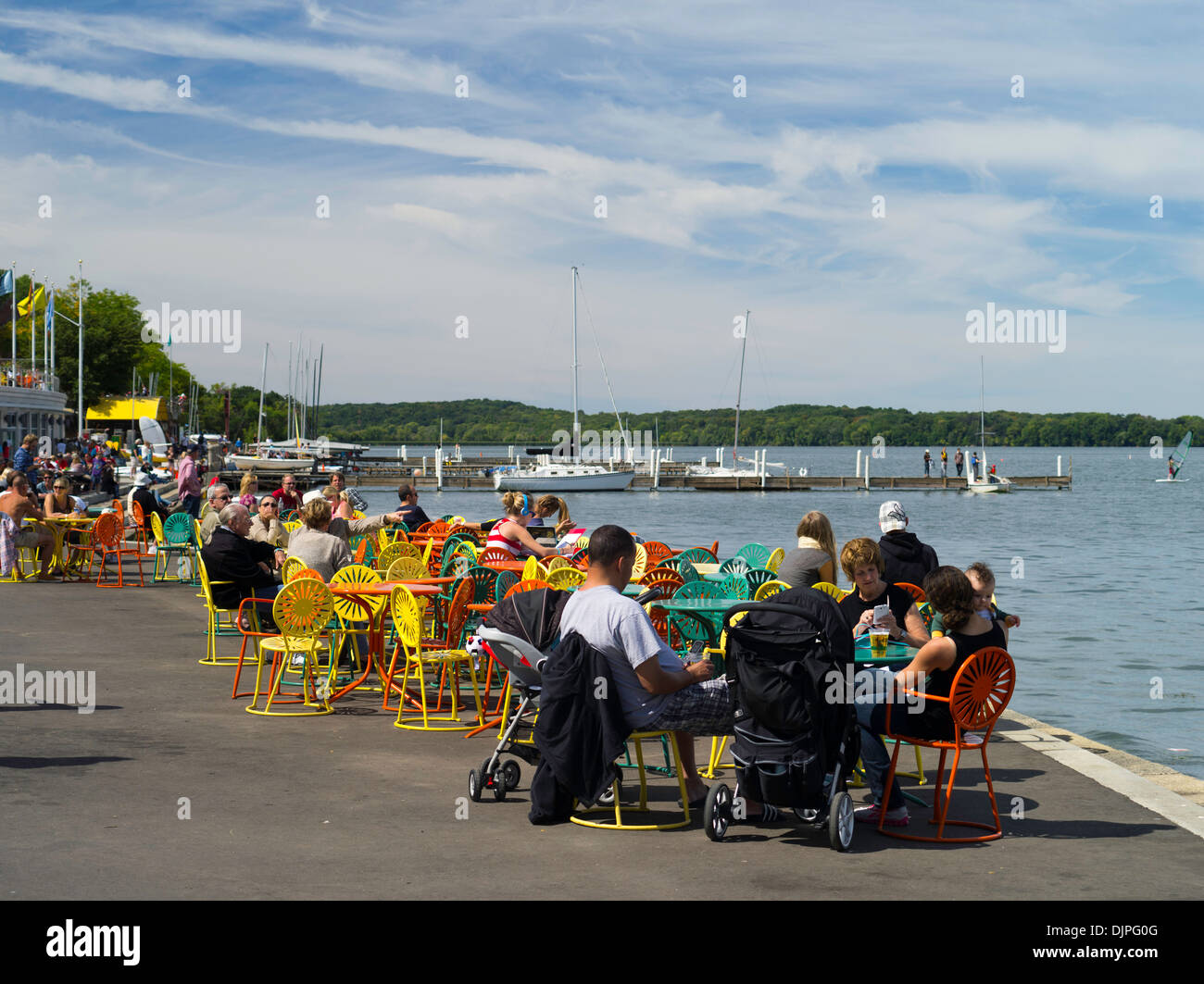 People relax along the shore of Lake Mendota at the Memorial Union