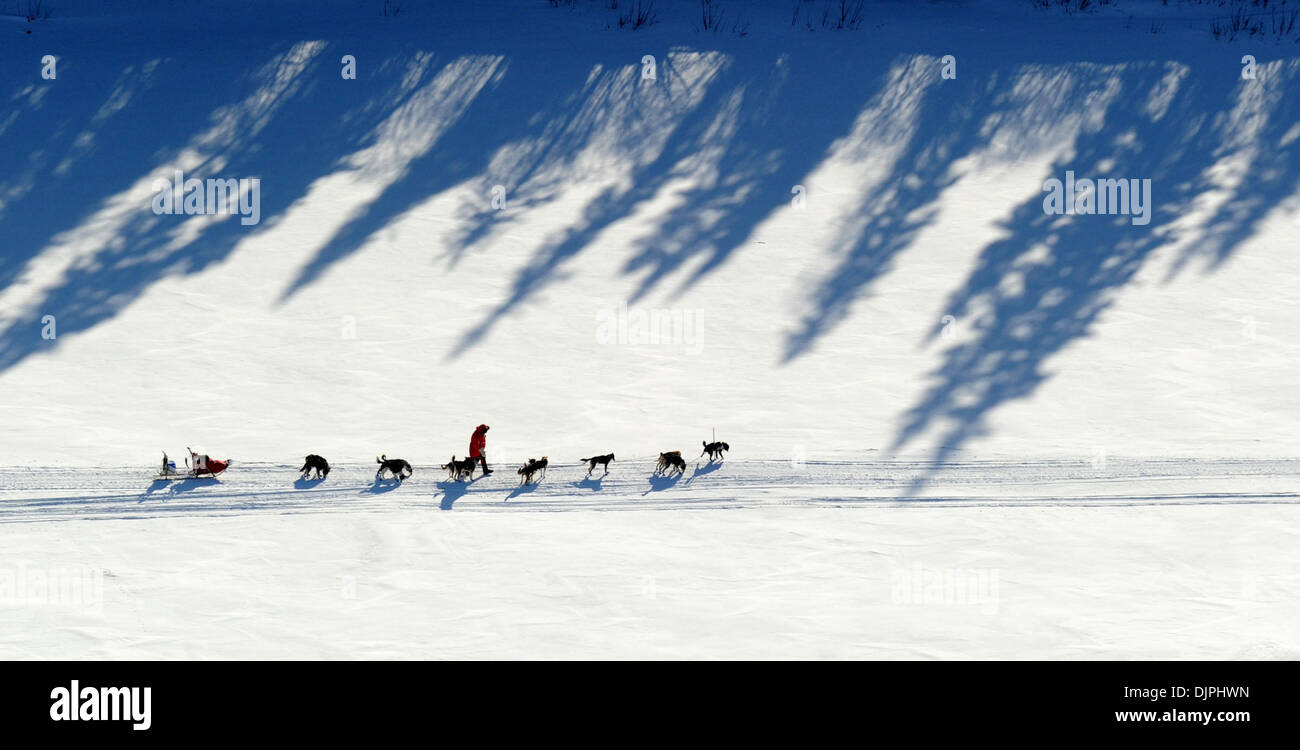 Mar 13, 2010 - Kaltag, Alaska, USA - A musher drives his team on the Yukon River on Saturday during the 2010 Iditarod Sled Dog Race. (Credit Image: © Bob Hallinen/Anchorage Daily News/ZUMA Press) Stock Photo