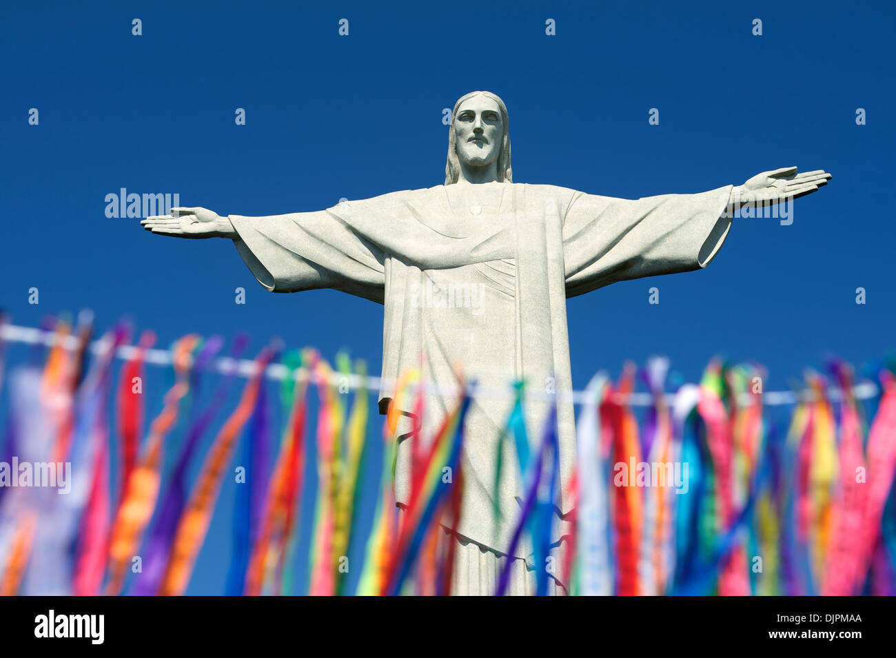 Rio Carnival celebration features colorful streamers known as lembranca at statue of Corcovado Stock Photo