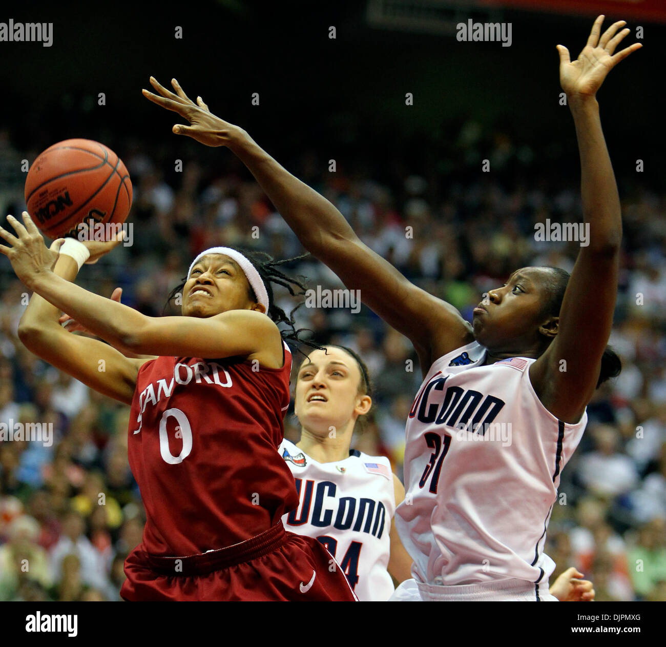 Apr. 06, 2010 - San Antonio, TX, USA - Stanford's Melanie Murphy drives to the hoop Tuesday night April 6, 2010 at the Alamodome in San Antonio, Texas during the NCAA Women's Final Four Championship game while UConn's Kelly Faris, center, and Tina Charles defend her. (Credit Image: © San Antonio Express-News/ZUMApress.com) Stock Photo