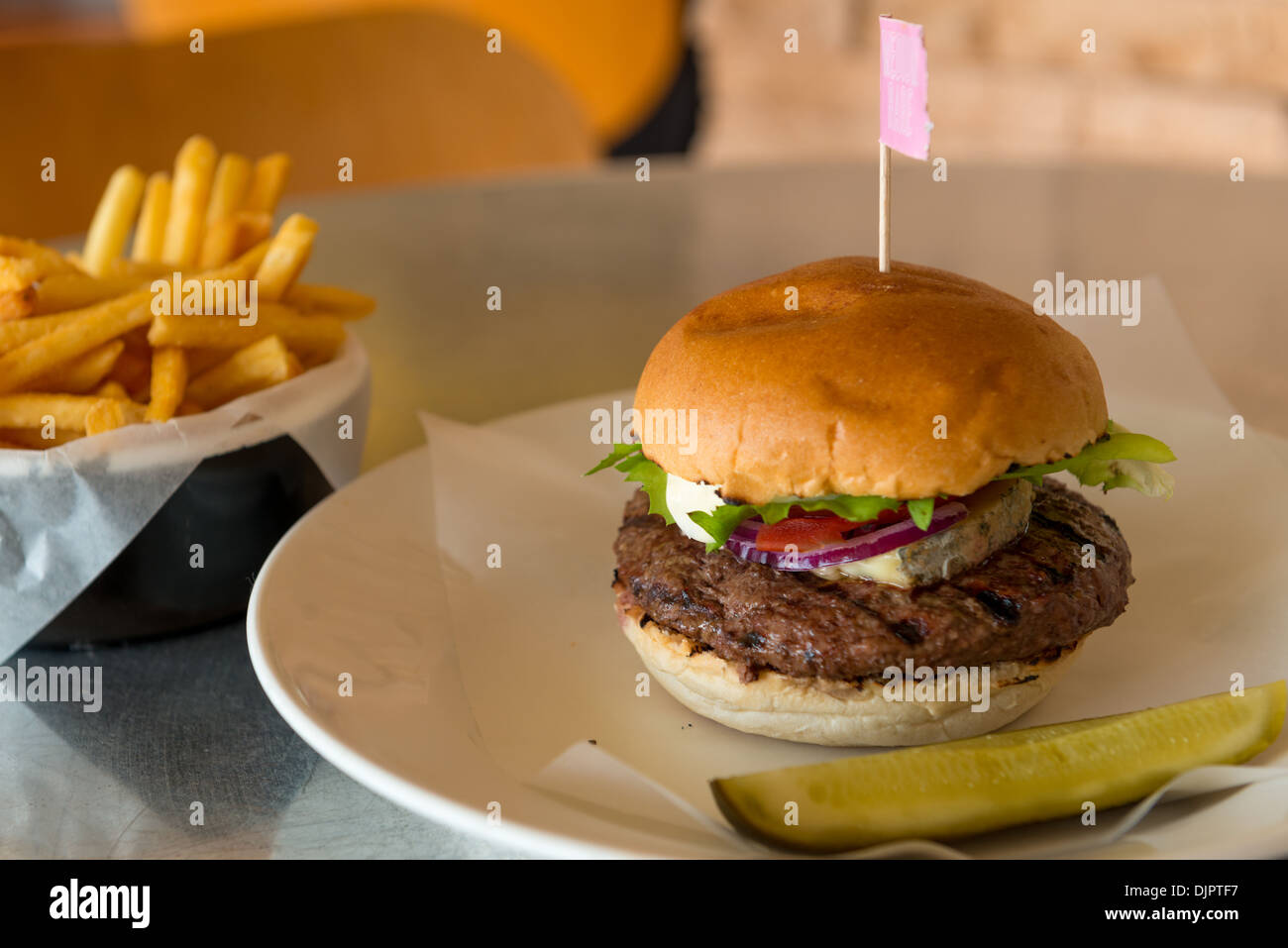 Blue cheese burger with fries and pickle Stock Photo