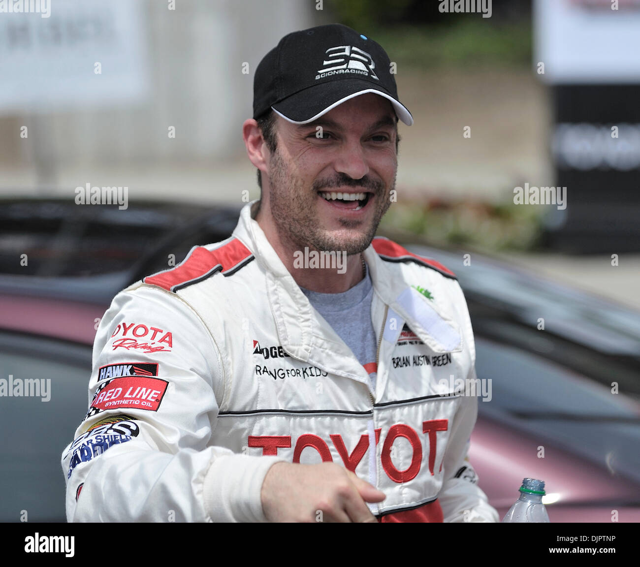 Apr. 17, 2010 - Long Beach, California, U.S. - LONG BEACH, CALIF. USA -- Celebrity Brian Austin Green is all smiles after winning the Pro/Celebrity race during Toyota Grand Prix of Long Beach, Calif  on April 17, 2010. Nikko Gonzalez is the son of Tony Gonzalez, tight end for the Atlanta Falcons and this year's Pro/Celebrity Grand Marshall..Photo by Jeff Gritchen / Long Beach Press Stock Photo