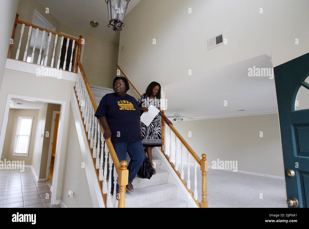 Apr. 23, 2010 - Cordova, TN, U.S. - 23 April 10 (kptax) by Karen Pulfer Focht: Michelle Hayes shows a home to Vivian Christian (left) on Friday. Christian is checking out maybe the 40th home she has toured in recent months and well aware it's Friday, April 23. Just eight days before the deadline for first-time home buyers like her to sign a purchase contract and claim up to an ,000 Stock Photo
