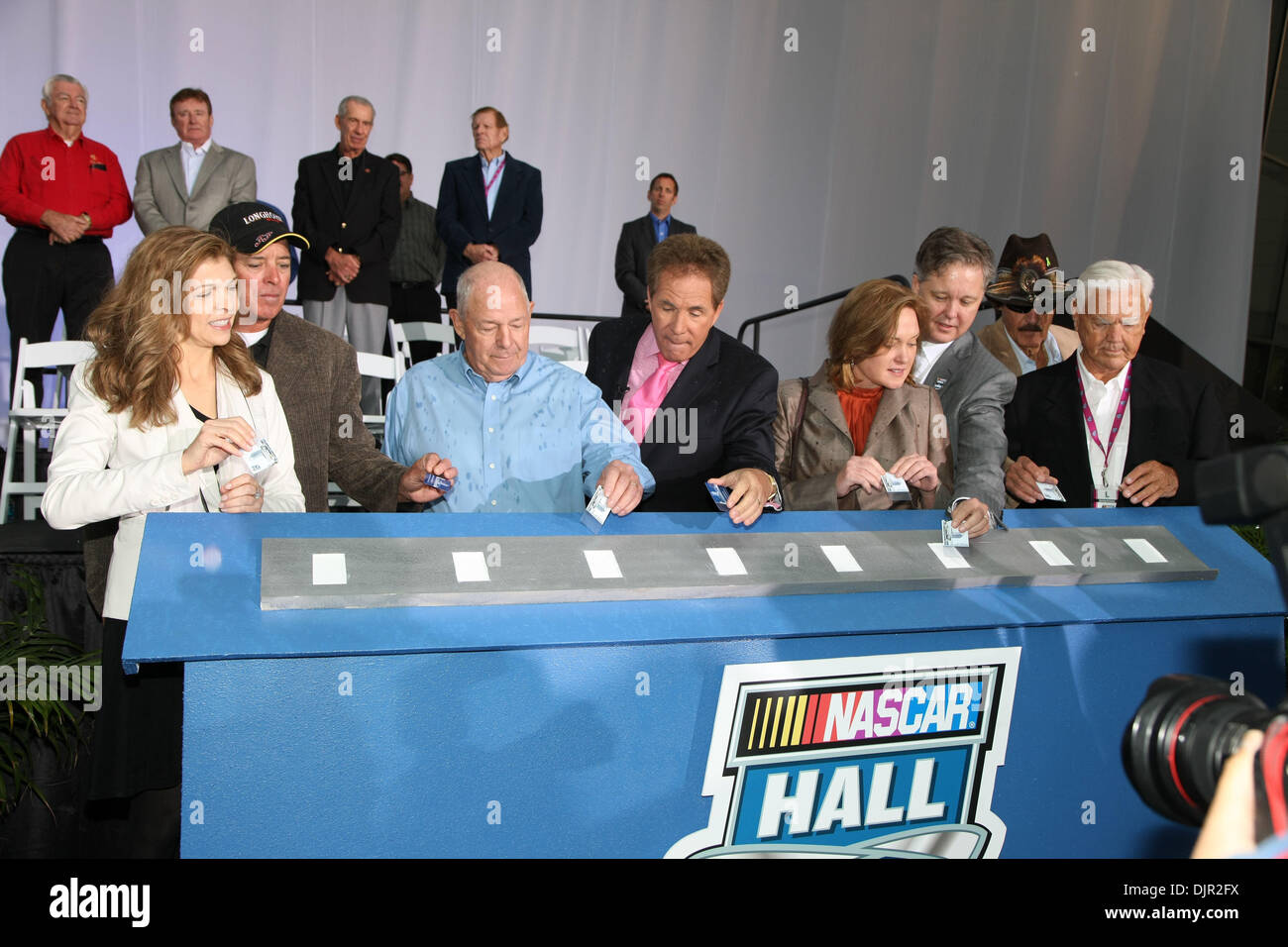 May 11, 2010 - Charlotte, North Carolina, U.S. - Grand Opening of the Nascar Hall of Fame festivities saw from left, TERESA EARNHARDT, RON HORNADAY JR., JACK INGRAM, DARELL WALTRIP, LISA FRANCE KENNEDY, BRIAN FRANCE (behind Lisa France Kennedy), RICHARD PETTY and JUNIOR JOHNSON officially open the Hall. The Nascar Hall of Fame is located in Charlotte, North Carolina.  (Credit Image Stock Photo