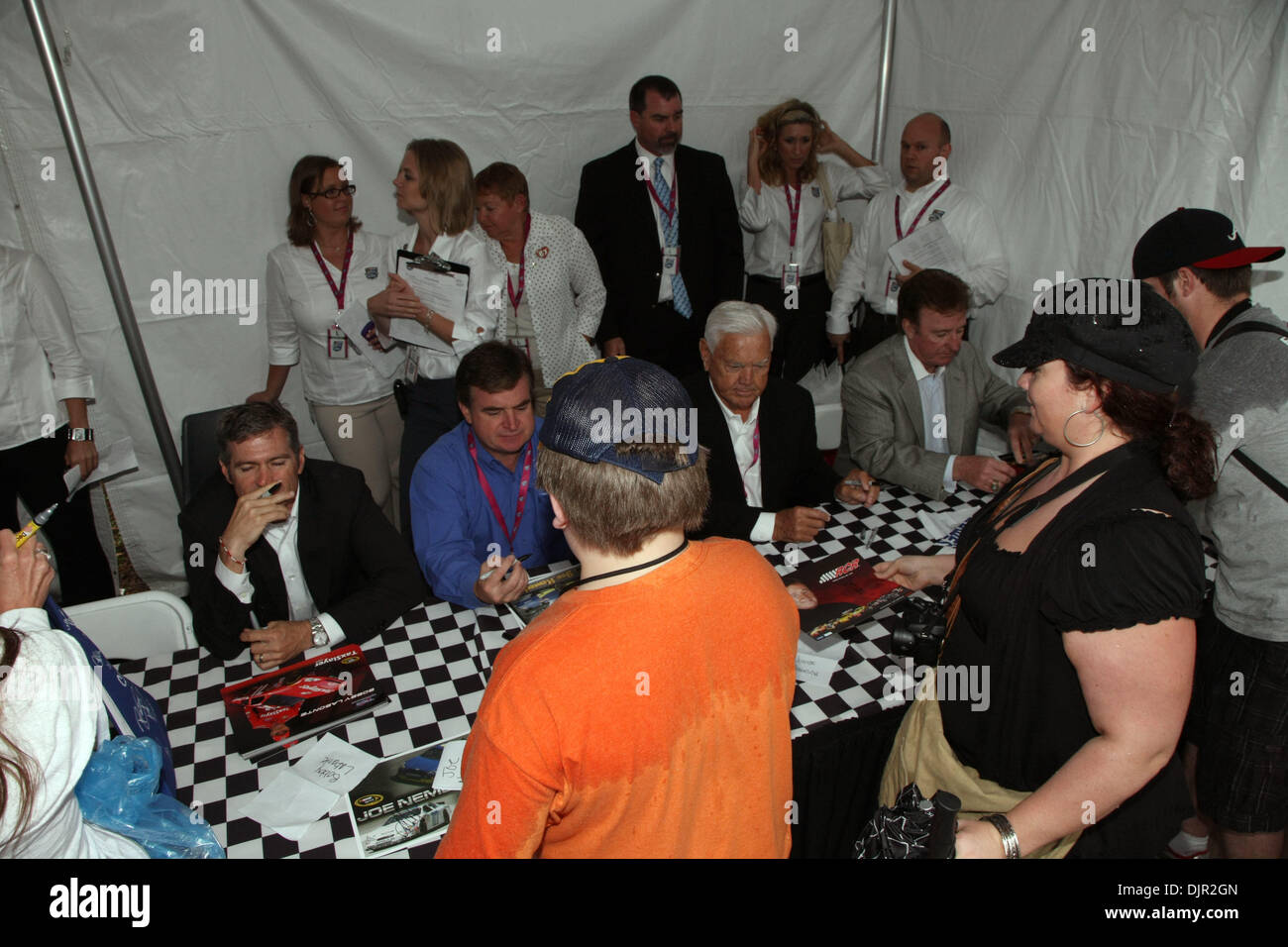 May 11, 2010 - Charlotte, North Carolina, U.S. - Grand Opening of the Nascar Hall of Fame festivities saw drivers of many eras signing autographs for waiting fans. BOBBY LABONTE, JOE NEMECEK, JUNIOR JOHNSON, RICHARD CHILDRESS. The Nascar Hall of Fame is located in Charlotte, North Carolina. (Credit Image: © Jim Dedmon/ZUMApress.com) Stock Photo