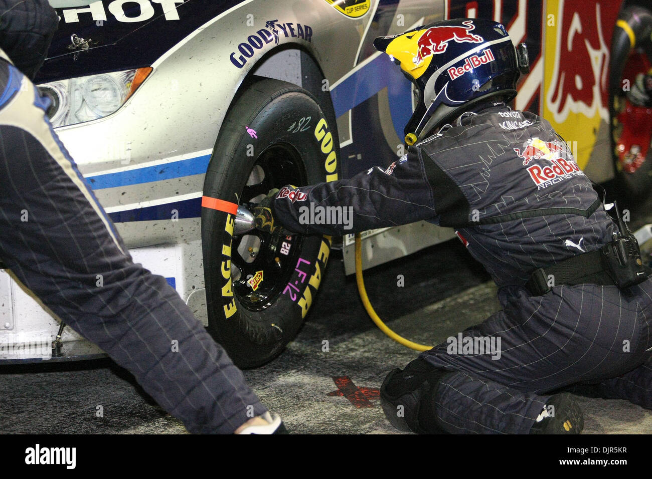 May 30, 2010 - Charlotte, North Carolina, U.S. - The front tire changer zips on the lugnuts onto the #83 Red Bull car driven by SCOTT SPEED during the Coca Cola 600 at Lowes Motor Speedway in Charlotte. (Credit Image: © Jim Dedmon/ZUMApress.com) Stock Photo