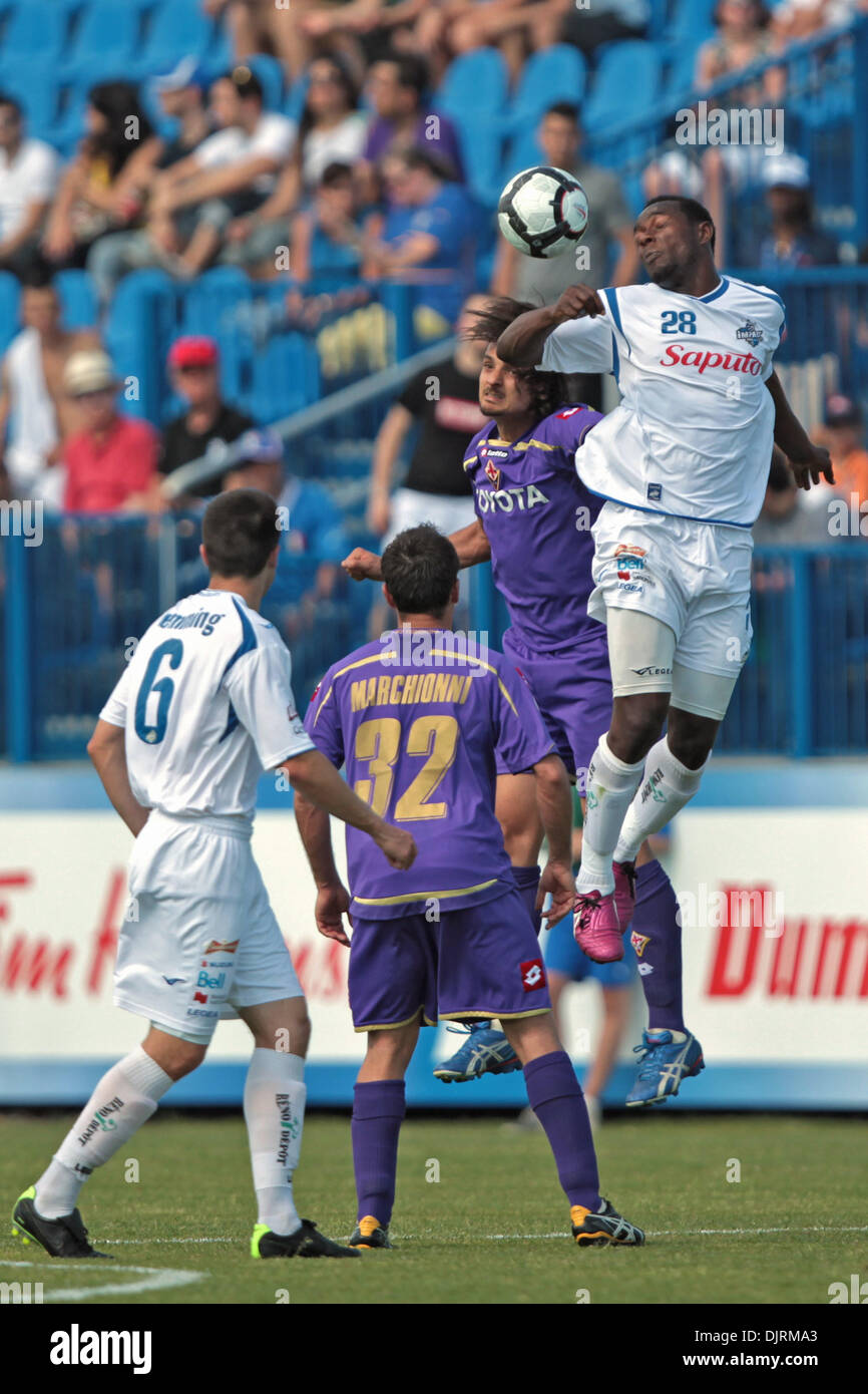 May 23, 2010 - Montreal, Quebec, Canada - 23 May 2010: Montreal Impact's forward Peter Byers(#28) and Fiorentina's defender Felipe (#16) battle for the ball under the eyes of Montreal Impact's midfielder Tyler Hemming(#6) and Fiorentina's midfielder Marco Marchionni (#32) in game action during the second half of play of the FIFA game between AFC Fiorentina and the Montreal Imapct p Stock Photo