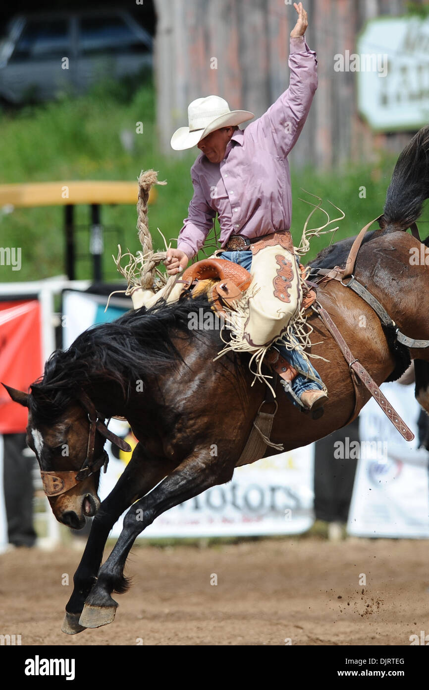 May 09, 2010 - Sonora, California, U.S - 09 May 2010: Saddle bronc rider John Flook rides Slum Lord at the 2010 Mother Lode Round-Up in Sonora, CA. (Credit Image: © Matt Cohen/Southcreek Global/ZUMApress.com) Stock Photo