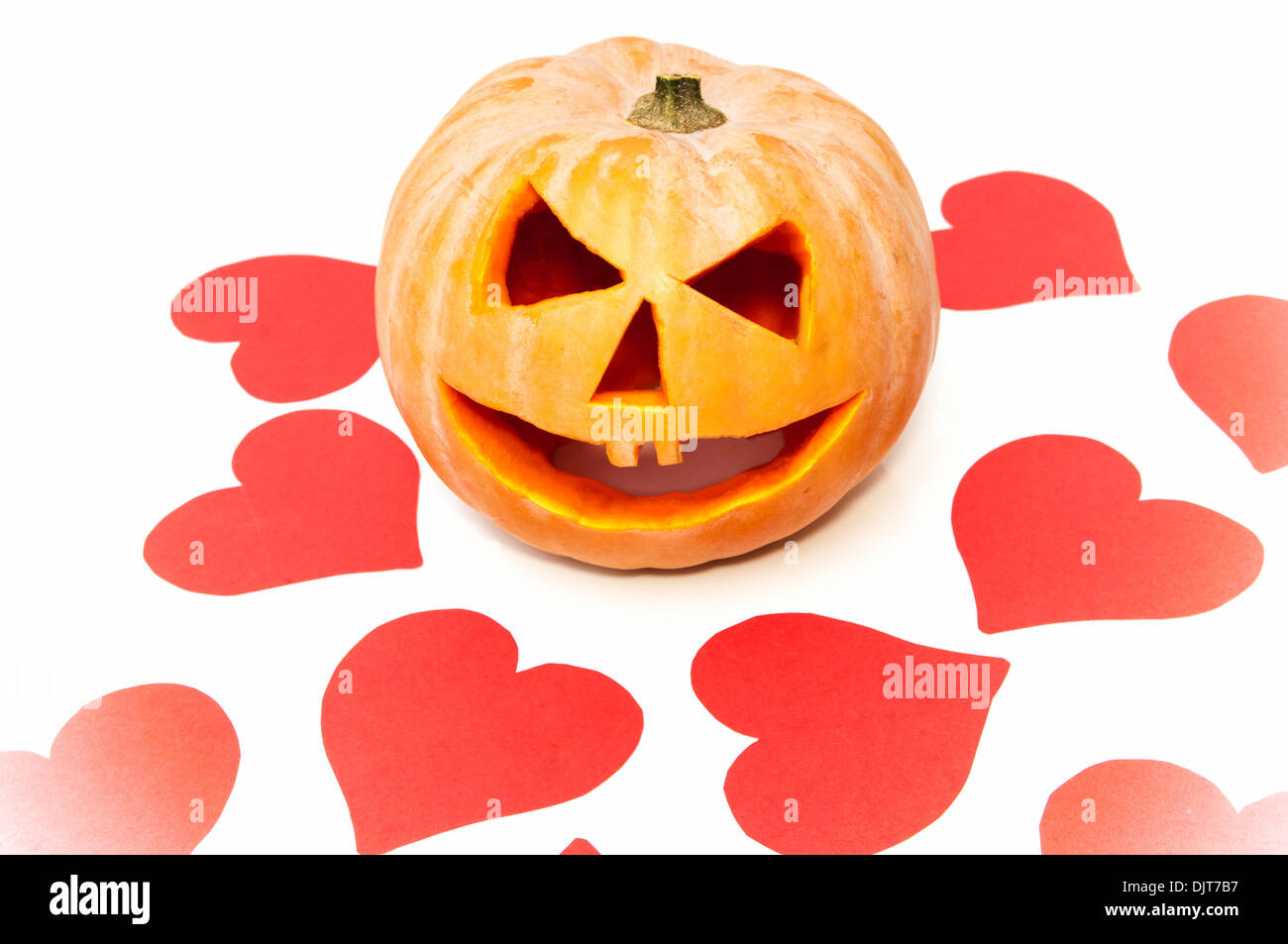 halloween pumpkin with hearts on a white background Stock Photo Alamy