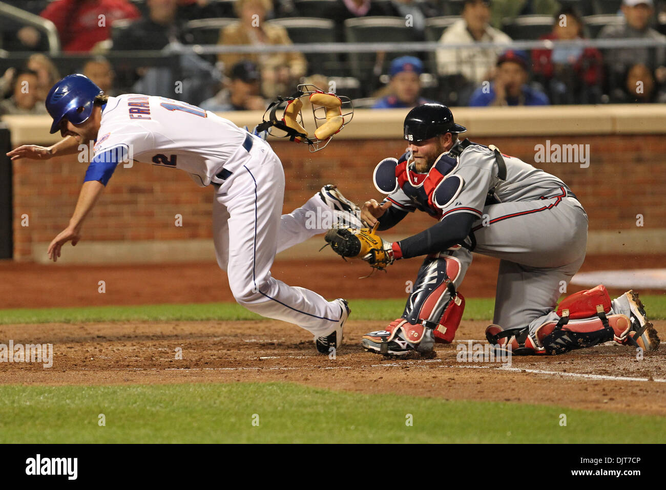 Mets Outfielder Jeff Francoeur  (#12) out as Atlanta Braves Catcher Brian McCann  (#16) tags him at the plate.  The Mets defeated the Braves 5-2 in the game at Citifield, Flushing, NY. (Credit Image: © Anthony Gruppuso/Southcreek Global/ZUMApress.com) Stock Photo