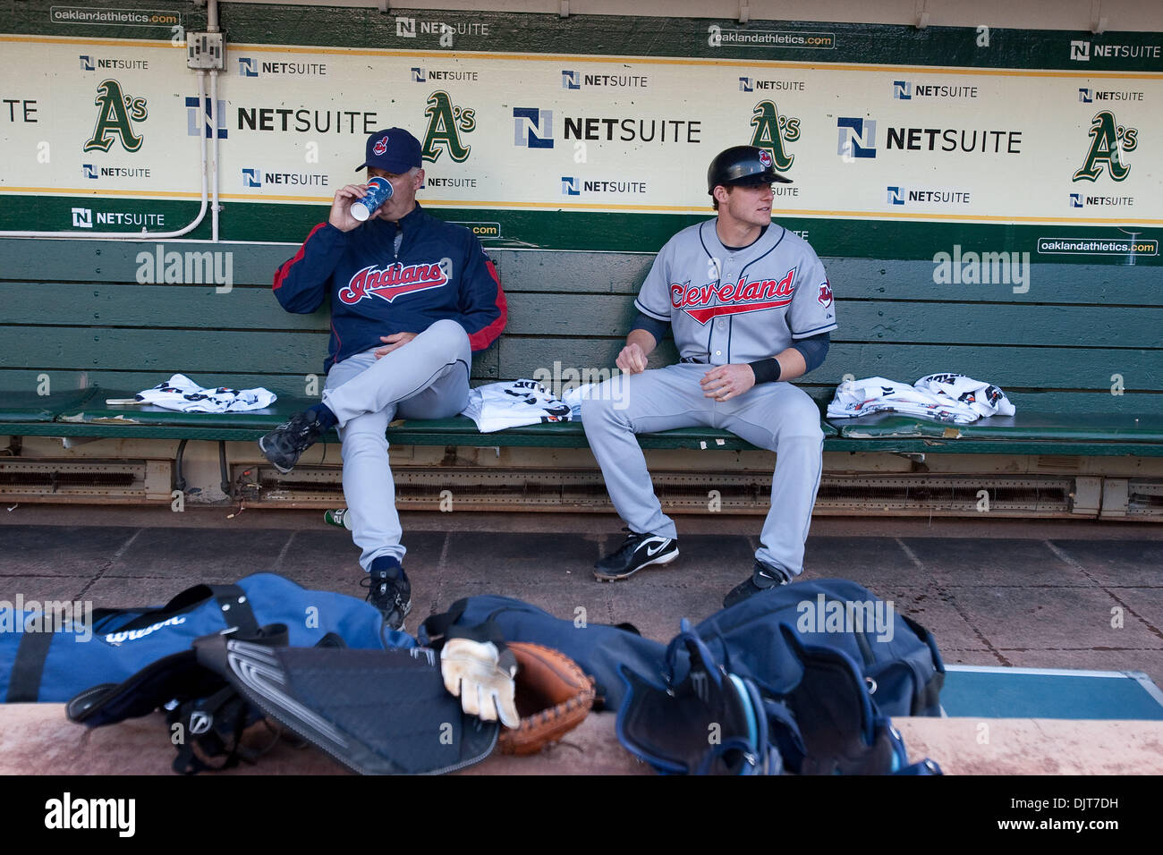 Oakland, Calif. - Cleveland Indians C Lou Marson (30) sits on the bench with pitching Coach Tim Belcher (49) during pregame warmups on Friday at the Oakland-Alameda County Coliseum. The Oakland Athletics defeated the Cleveland Indians 10-0. (Credit Image: © Konsta Goumenidis/Southcreek Global/ZUMApress.com) Stock Photo