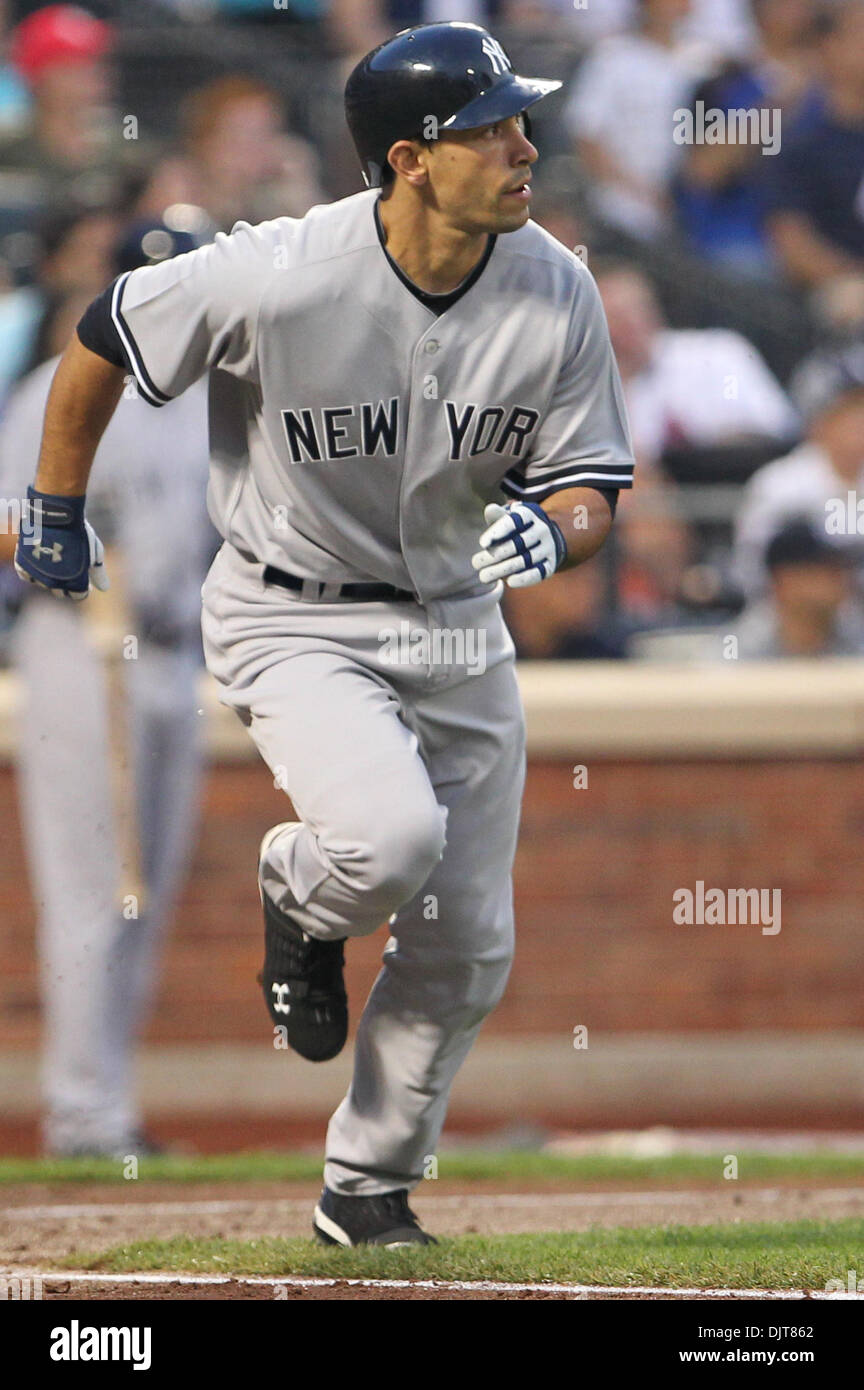 New York Yankees Infielder Nick Johnson (26) heads to first. The