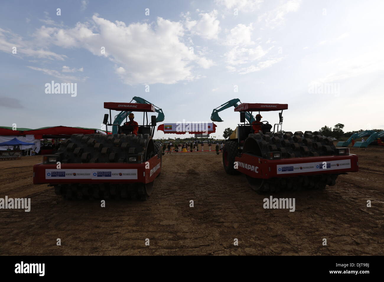 Yangon, Myanmar. 30th Nov, 2013. Construction workers demonstrate with heavy tractors during the commencement ceremony of Thilawa SEZ Project in Yangon, Myanmar, Nov. 30, 2013. Myanmar on Saturday began construction of the first phase of Thilawa Special Economic Zone project on the outskirts of Yangon. © U Aung/Xinhua/Alamy Live News Stock Photo