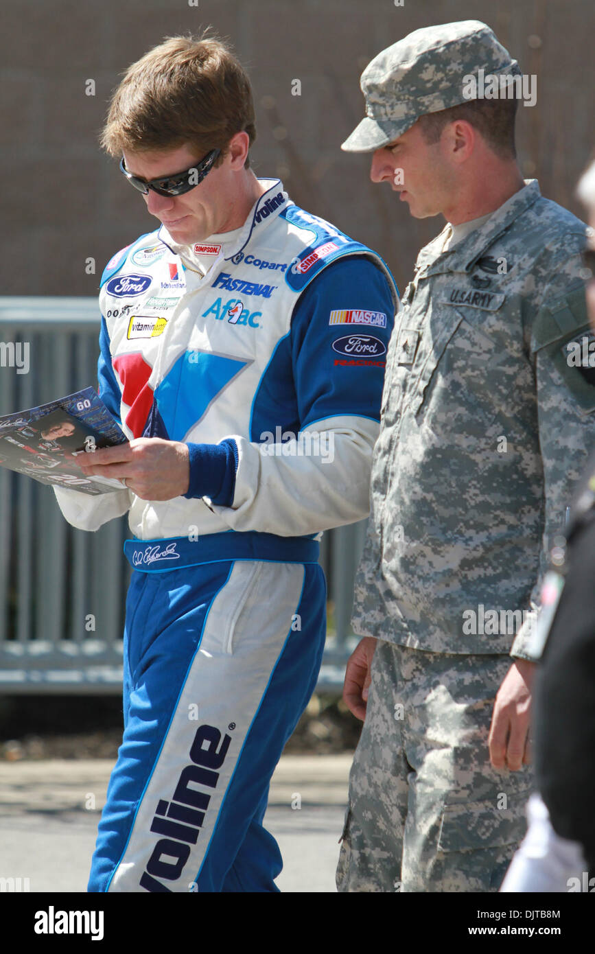 Carl Edwards signs an autograph for a soldier during the Nashville 300 ...