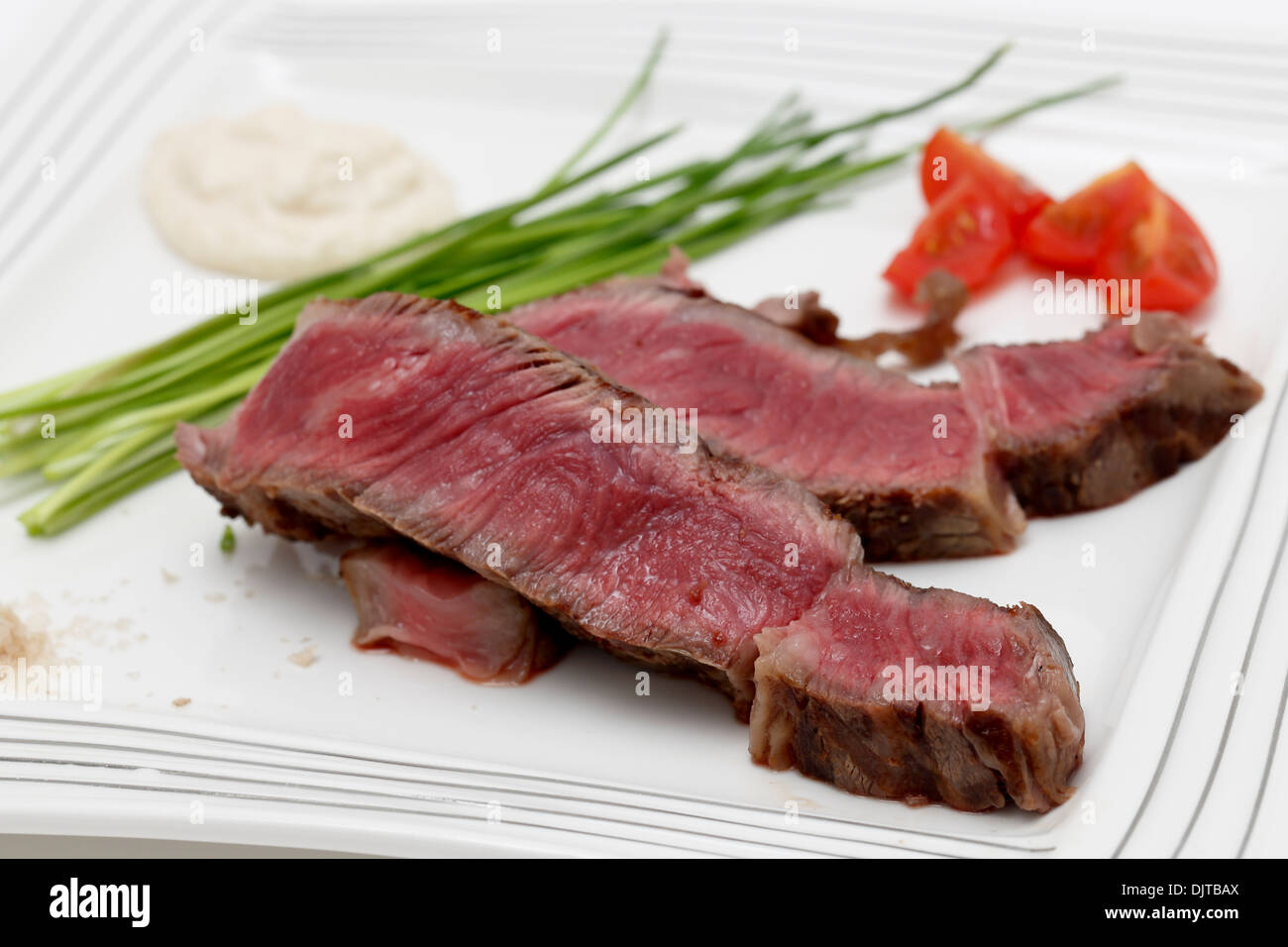 Grilled wagyu rump steak, served with chives, cherry tomatoes, sea salt ...