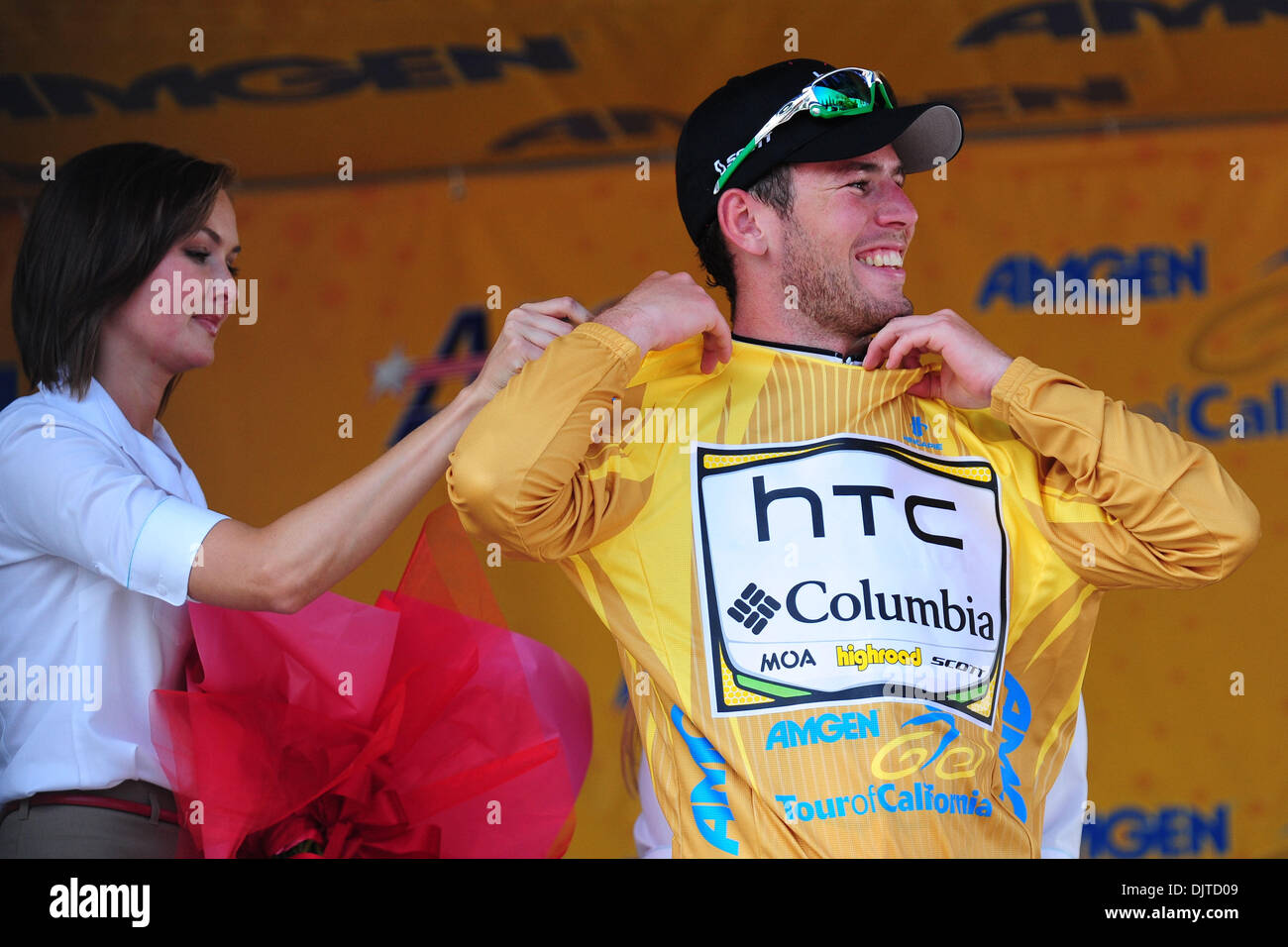 Mark Cavendish of Team HTCColumbia dons the race leader yellow jersey