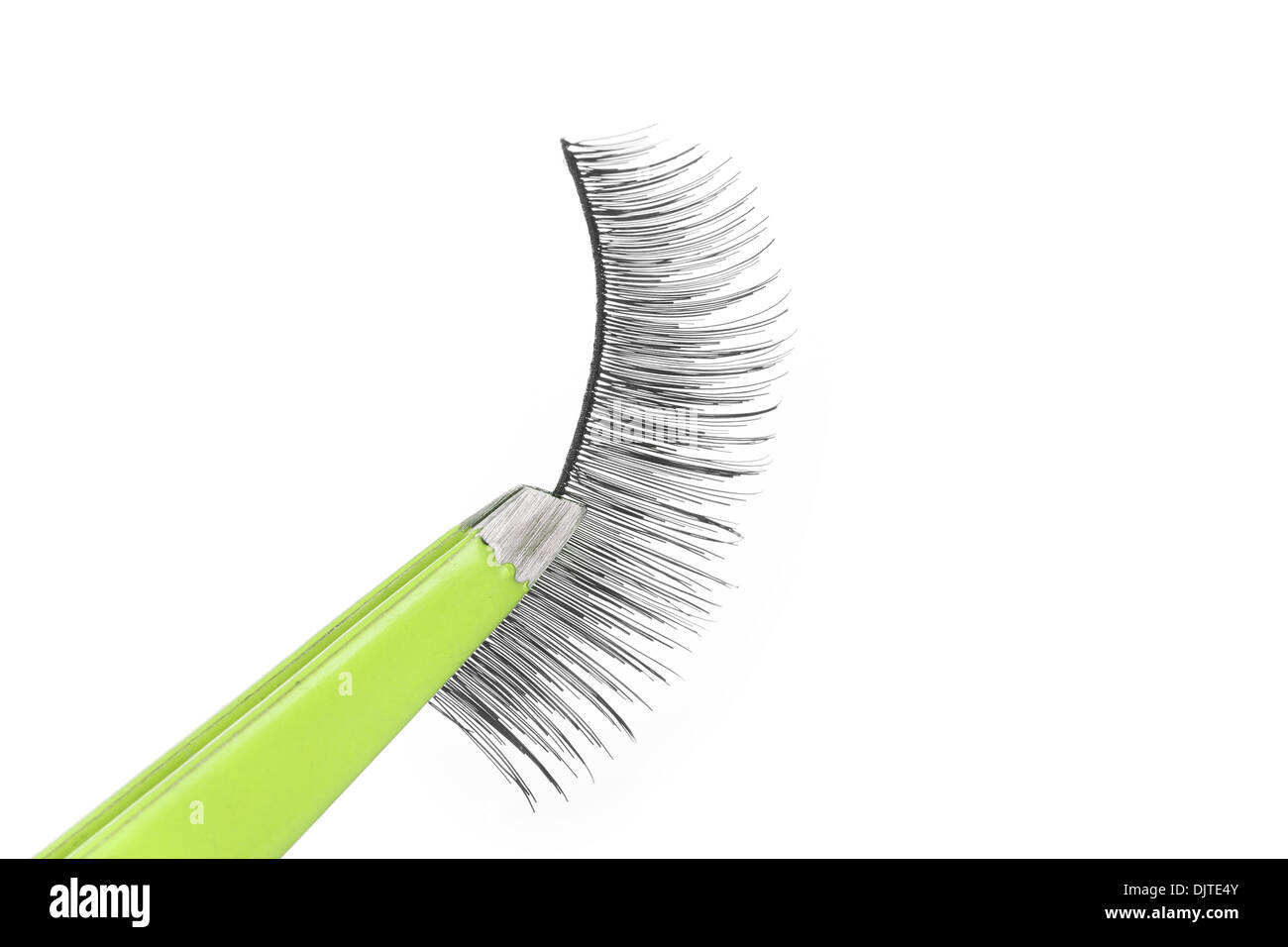 False lashes and green pincers, closeup on white background  Stock Photo