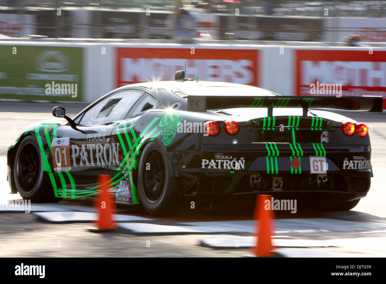 The number 01 Ferrari 430 GT Driven by Scott Sharp heads into turn 11 ...