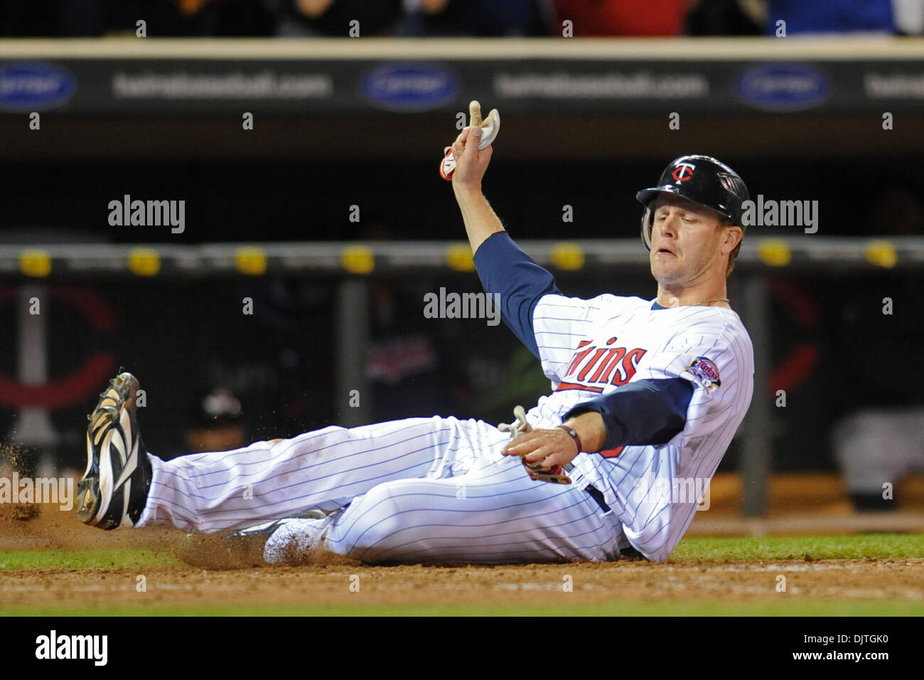 Minnesota Twins first baseman Justin Morneau 33 slides into home on a triple by right fielder Michael Cuddyer 5 in the 8th inning of the Twins baseball game against the Cleveland Indians