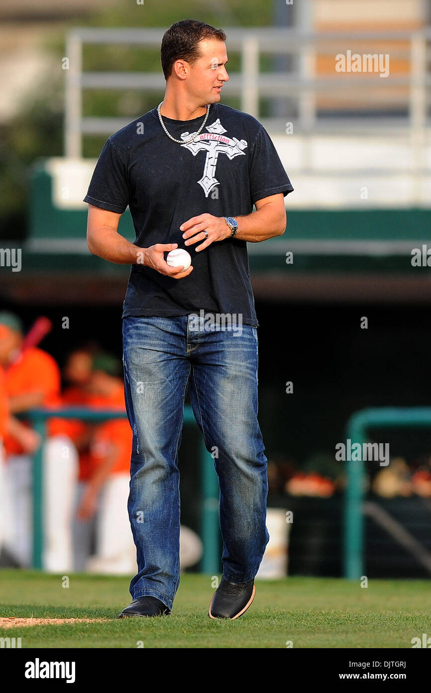 Florida Marlin first baseman and Miami Hurricanes alumni Gaby Sanchez  prepares to throw out the first pitch. The 14th ranked Miami Hurricanes  defeated the University of South Florida Bulls 14-7 at Alex