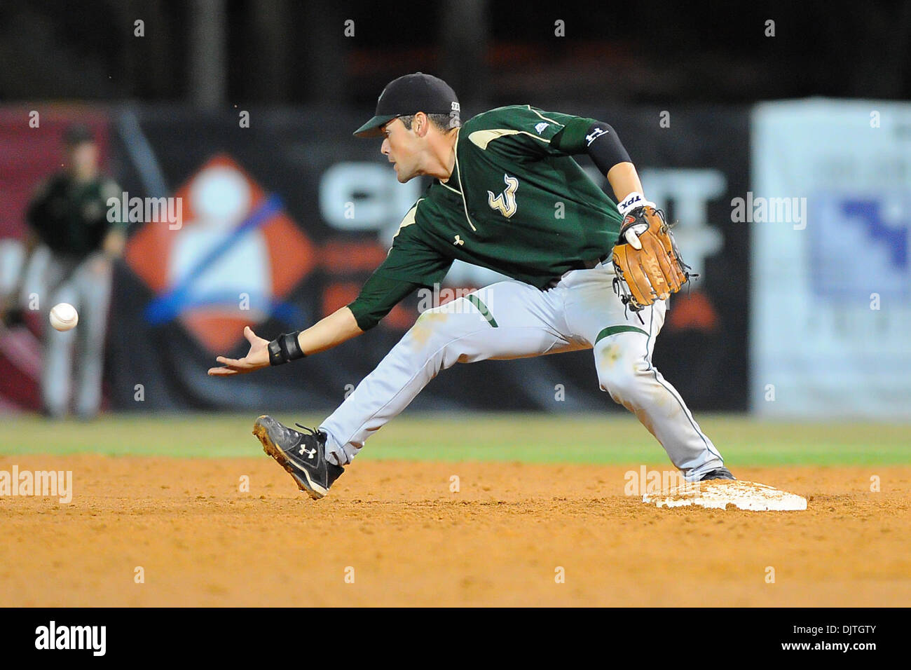 South Florida Bulls INF Luis Llerena (2) barehands throw from shortstop ...