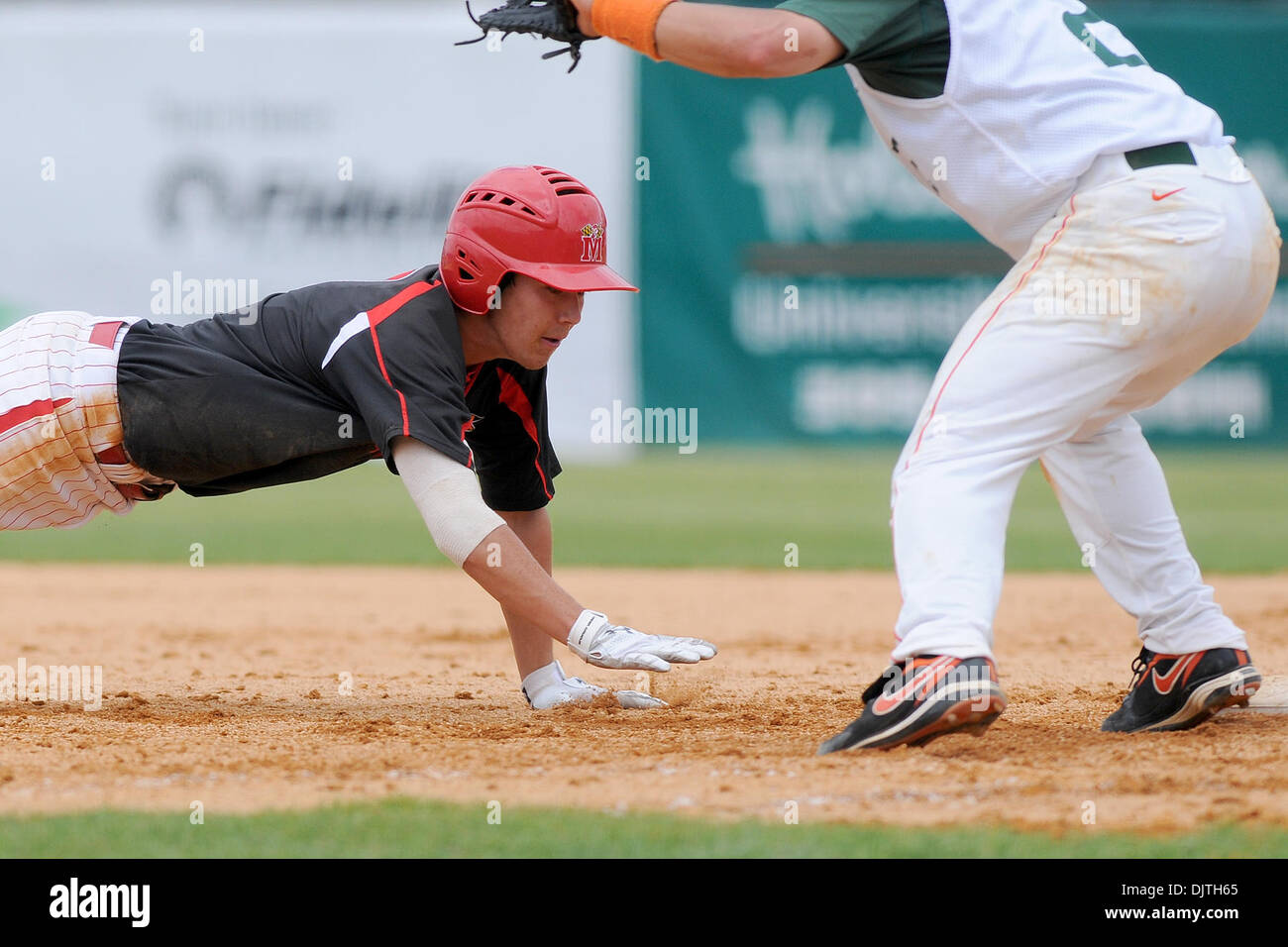 Maryland Terrapins INF Matthew Murakami (5) dives back safely to first base. The 14th ranked Miami Hurricanes defeated the University of Maryland Terrapins 9-1 at Alex Rodriguez Park in Coral Gables, Florida. (Credit Image: © Ron Hurst/Southcreek Global/ZUMApress.com) Stock Photo