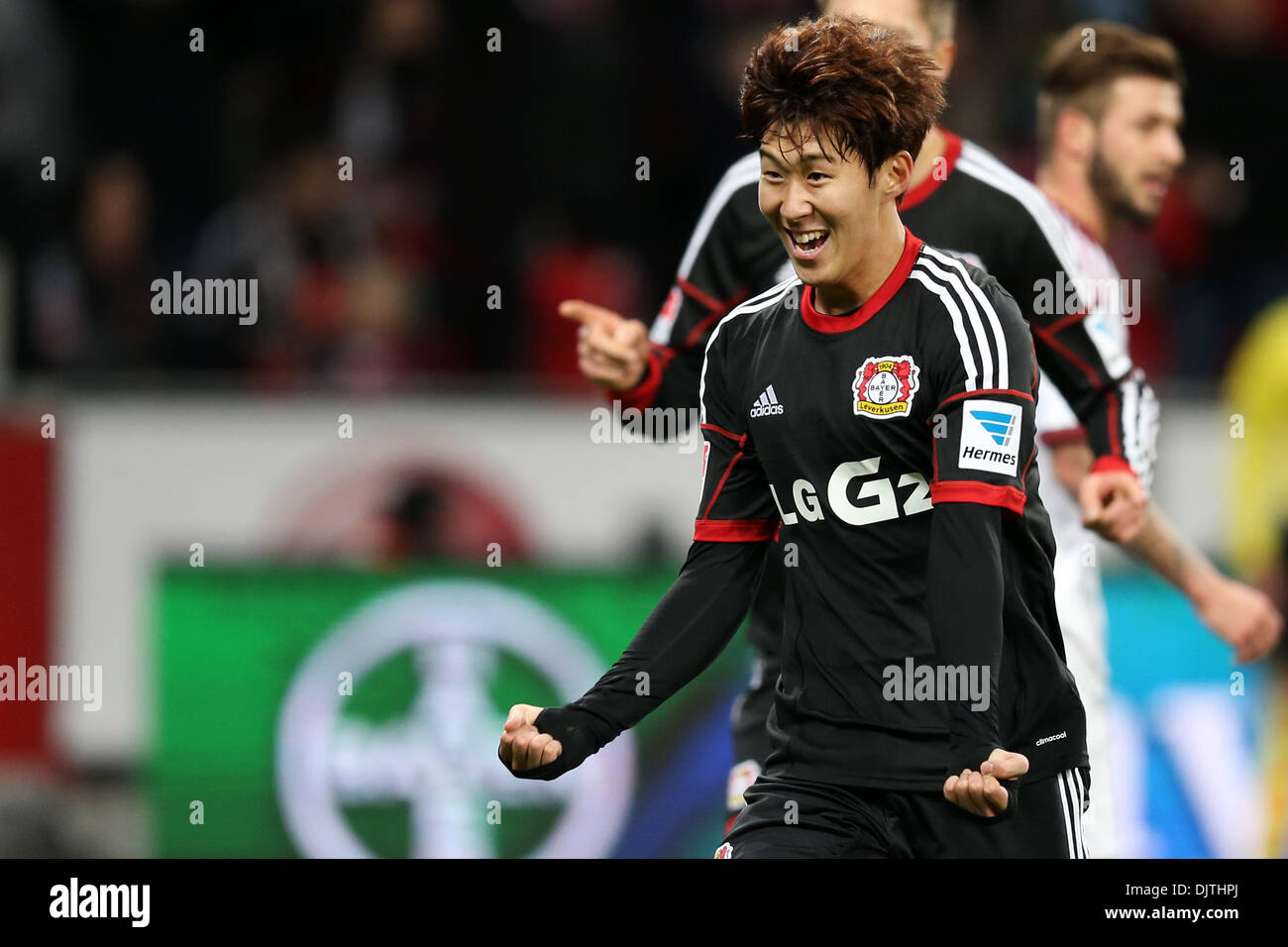 Leverkusen, Germany. 30th Nov, 2013. Leverkusen's Heung Min Son cheers after he scored for 1-0 during the Bundesliga soccer match between Bayer o4 Leverkusen and 1. FC Nuremberg in the BayArena in Leverkusen, Germany, 30 November 2013. Photo: Rolf Vennenbernd/dpa (ATTENTION: Due to the accreditation guidelines, the DFL only permits the publication and utilisation of up to 15 pictures per match on the internet and in online media during the match.)/dpa/Alamy Live News Stock Photo