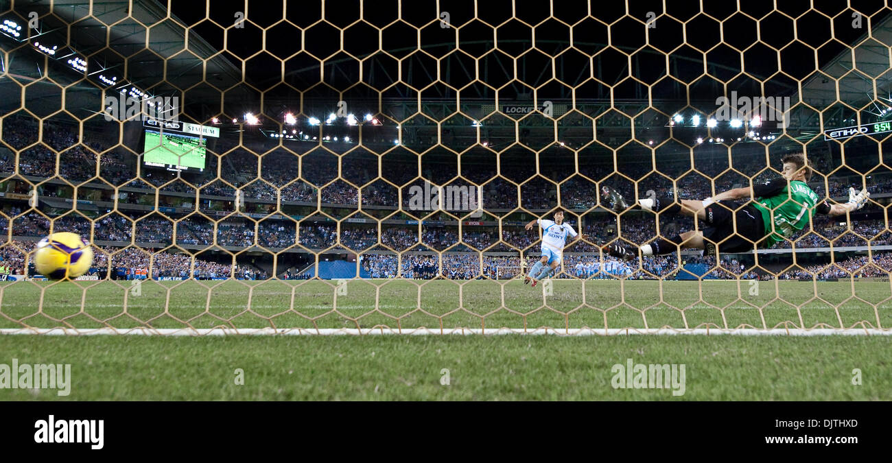 MELBOURNE, AUSTRALIA - MARCH 20, 2010: Sung Hwan Byun from Sydney FC kicks the winning goal in the penalty shoot out as Melbourne Victory keeper Mitchell Langerak dives in the wrong direction during the final of the 2010 A-League between the Melbourne Victory and Sydney FC at Etihad Stadium on March 20, 2010 in Melbourne, Australia. Sydney FC won the match on penalties 4-2. (Credit Stock Photo