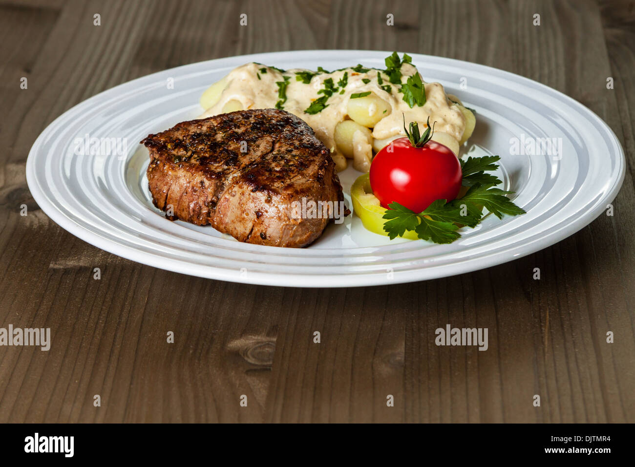 Beef steak with gnocchi and sauce Stock Photo Alamy