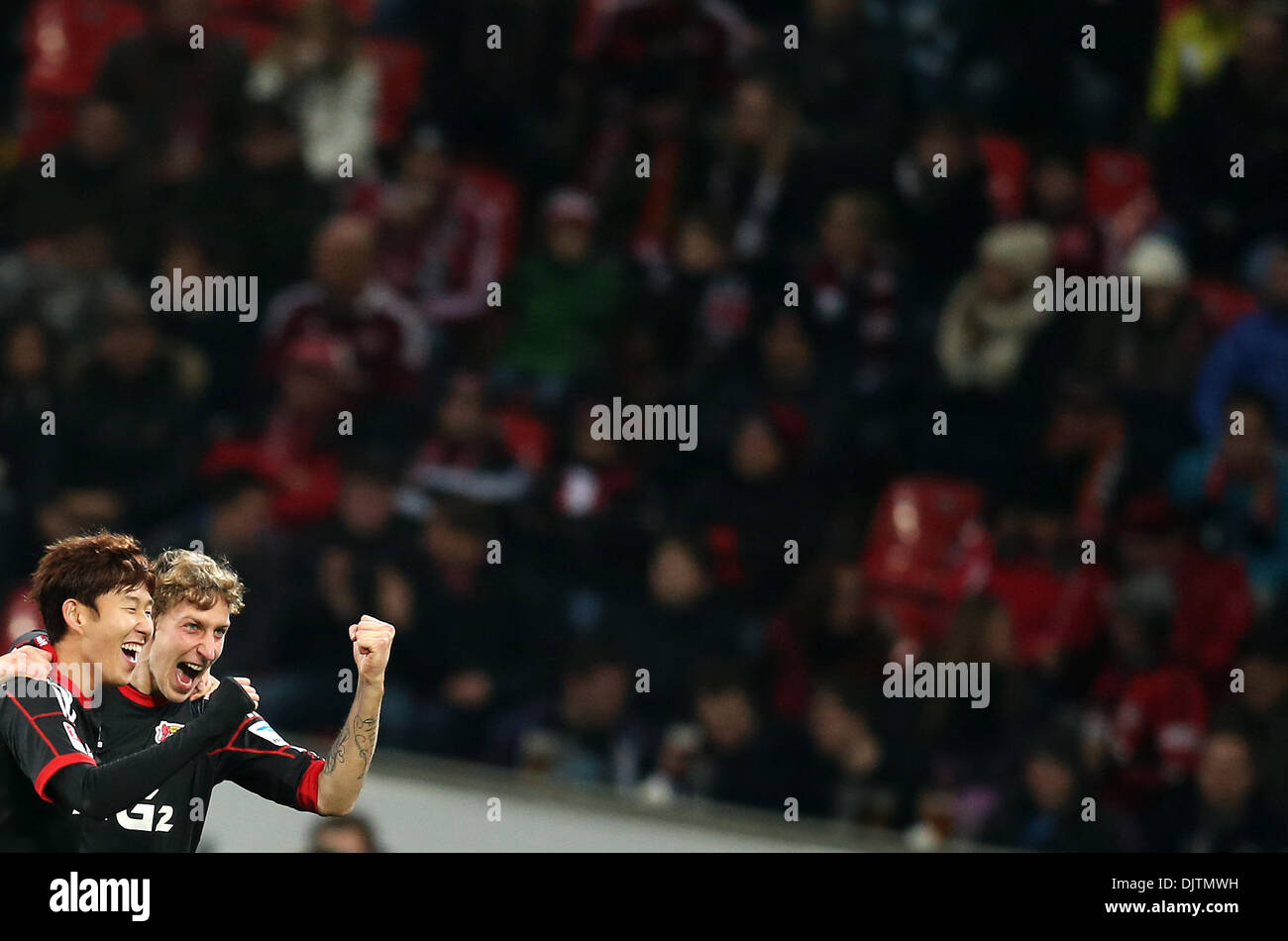 Leverkusen, Germany. 30th Nov, 2013. Leverkusen's Stefan Kießling (R) cheers with Heung Min Son after Kießling scored for 2-0 during the Bundesliga soccer match between Bayer o4 Leverkusen and 1. FC Nuremberg in the BayArena in Leverkusen, Germany, 30 November 2013. Photo: Rolf Vennenbernd/dpa (ATTENTION: Due to the accreditation guidelines, the DFL only permits the publication and utilisation of up to 15 pictures per match on the internet and in online media during the match.)/dpa/Alamy Live News Stock Photo