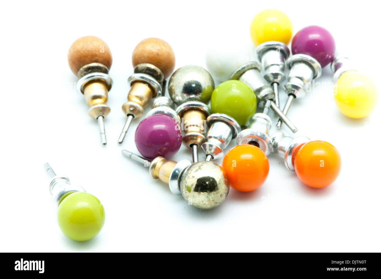 colored earrings on a white background Stock Photo