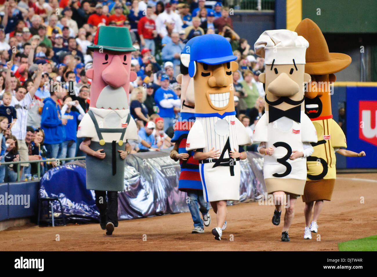 The racing sausages compete during the 7th inning stretch of the game